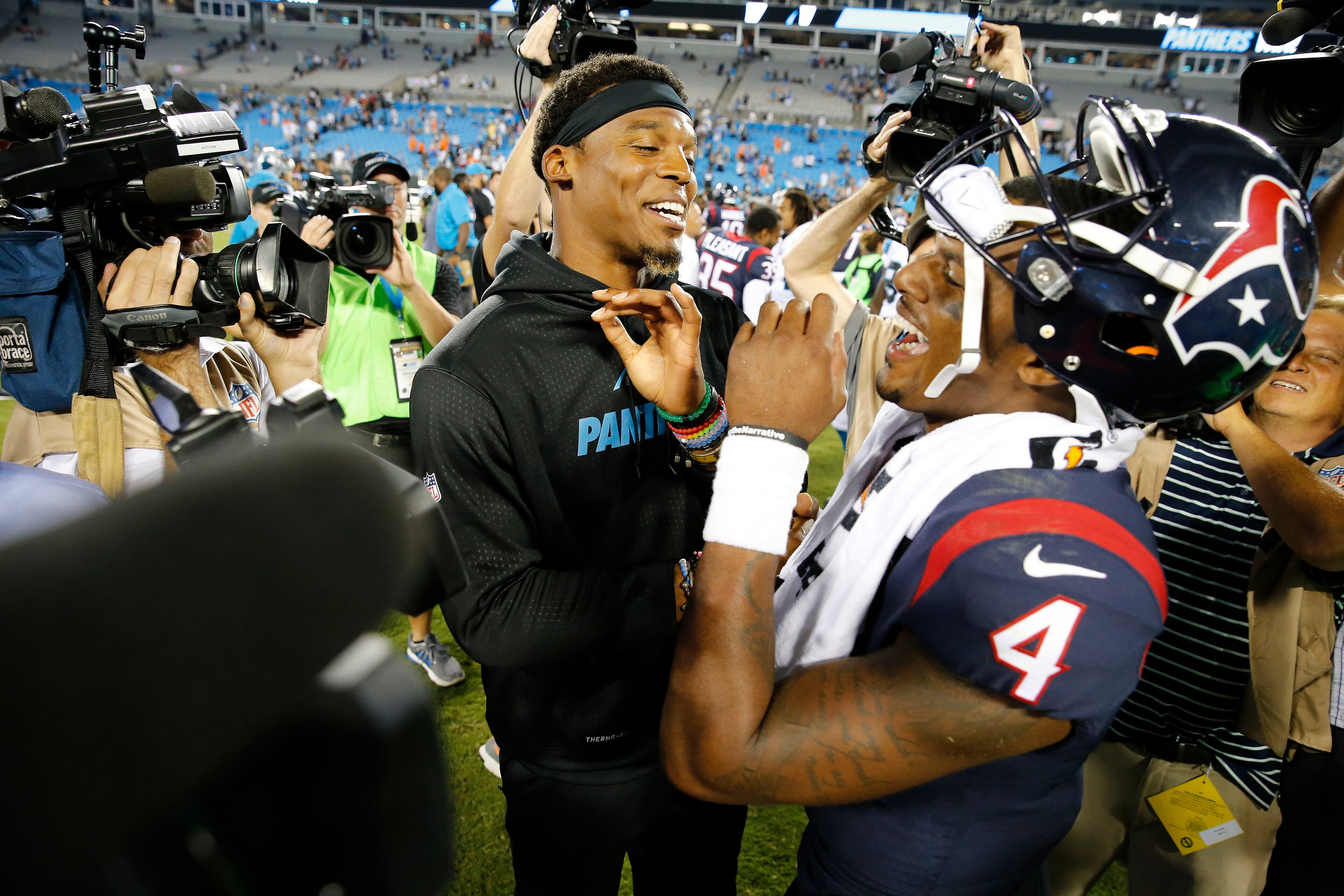 Carolina Panthers quarterback Cam Newton and Houston Texans quarterback Deshaun Watson (4) speak after the second half of an NFL preseason football game, Wednesday, Aug. 9, 2017, in Charlotte, N.C. The Panthers won 27-17. (AP Photo/Jason E. Miczek)