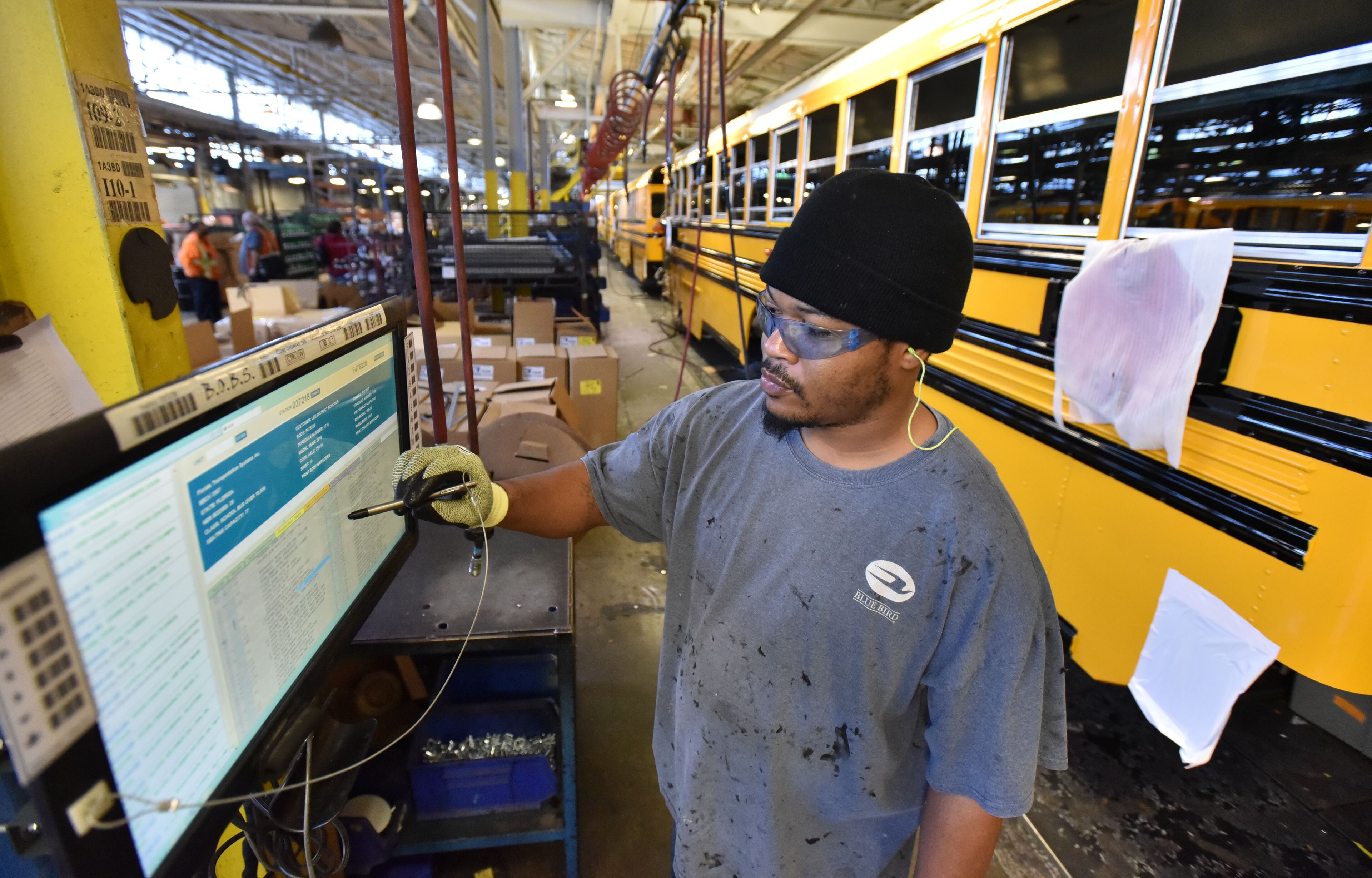 December 1, 2016 Fort Valley - Daniel Stripling checks his job order screen at the company's headquarters in Fort Valley on Tuesday, December 21, 2016. Blue Bird Corporation is one of those venerable, rural manufacturers that produces the kind of jobs that Trump's core supporters are expecting him to produce. It has been through the wringer, but seems to be on the rise now -- good news for its little home town of Fort Valley. HYOSUB SHIN / HSHIN@AJC.COM