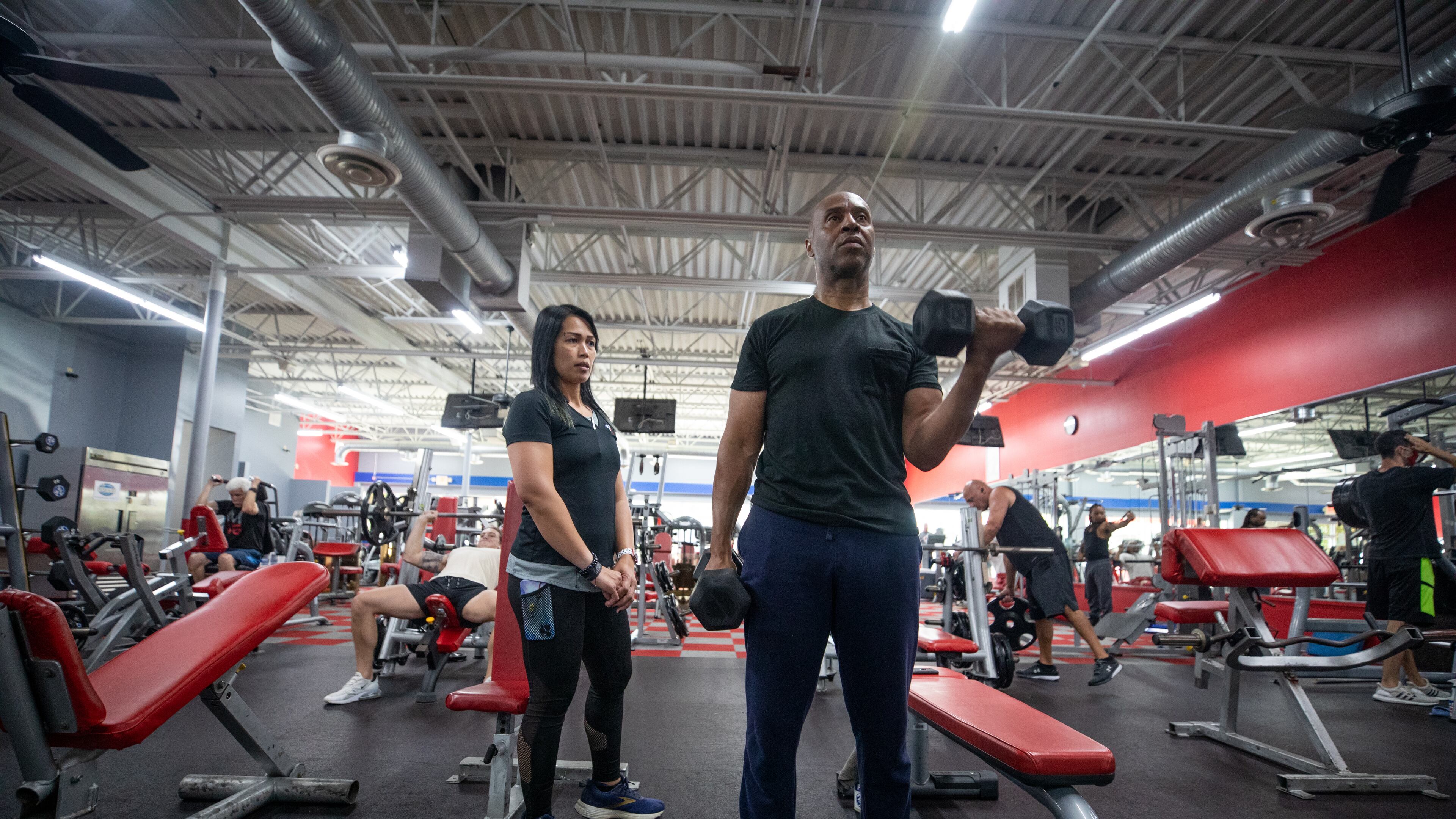 Christopher Ireland, CEO of RideShare, trains with Annabelle Tapponnier at Workout Anytime Gym in Marietta, Ga., on Thursday, Sept. 2, 2021. (Photo/Jenn Finch, The Atlanta Journal-Constitution)