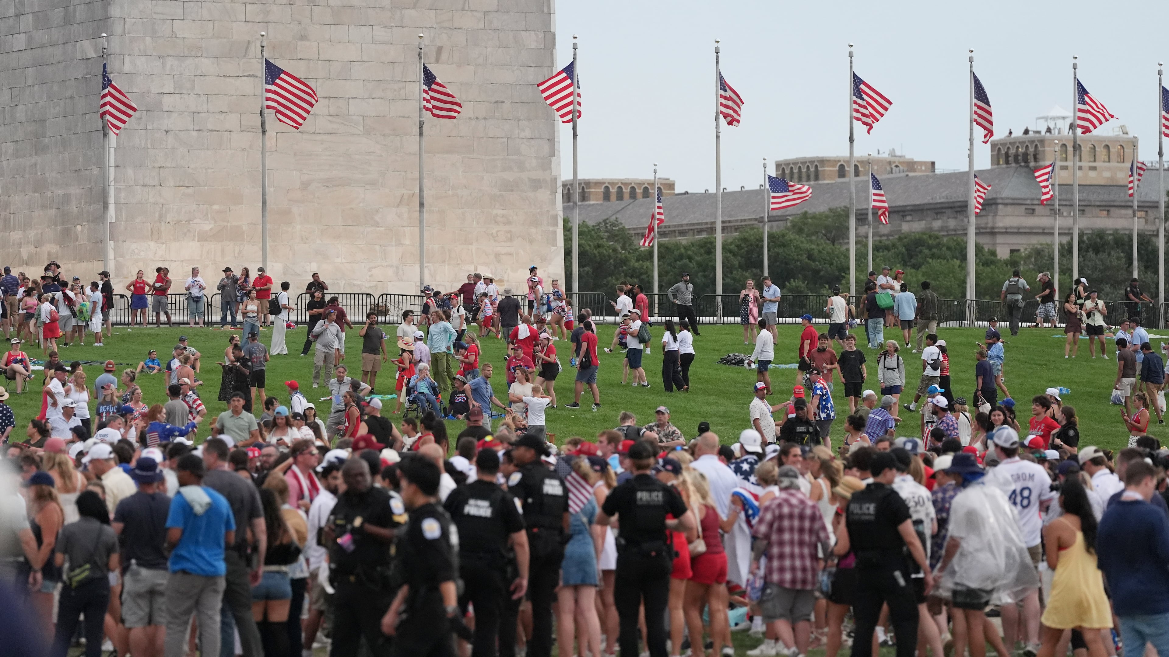 Law enforcement secure the area as people evacuate because of incoming storms that will delay the program at a Salute to America Independence Day event honoring the nation's 250th anniversary, Saturday, July 4, 2026, on the National Mall in Washington. (AP Photo/Alex Brandon)