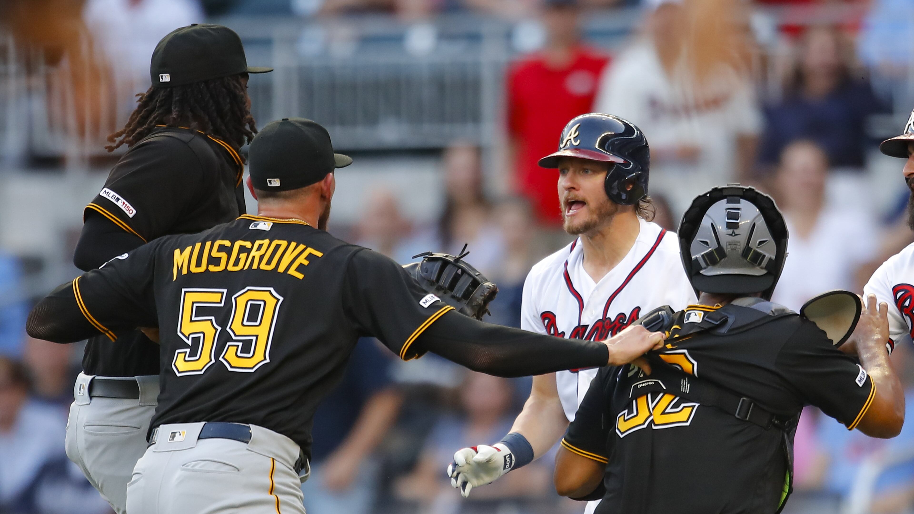 Braves Josh Donaldson and Pittsburgh pitcher Joe Musgrove exchange unpleasantries Monday night. (Photo by Todd Kirkland/Getty Images)