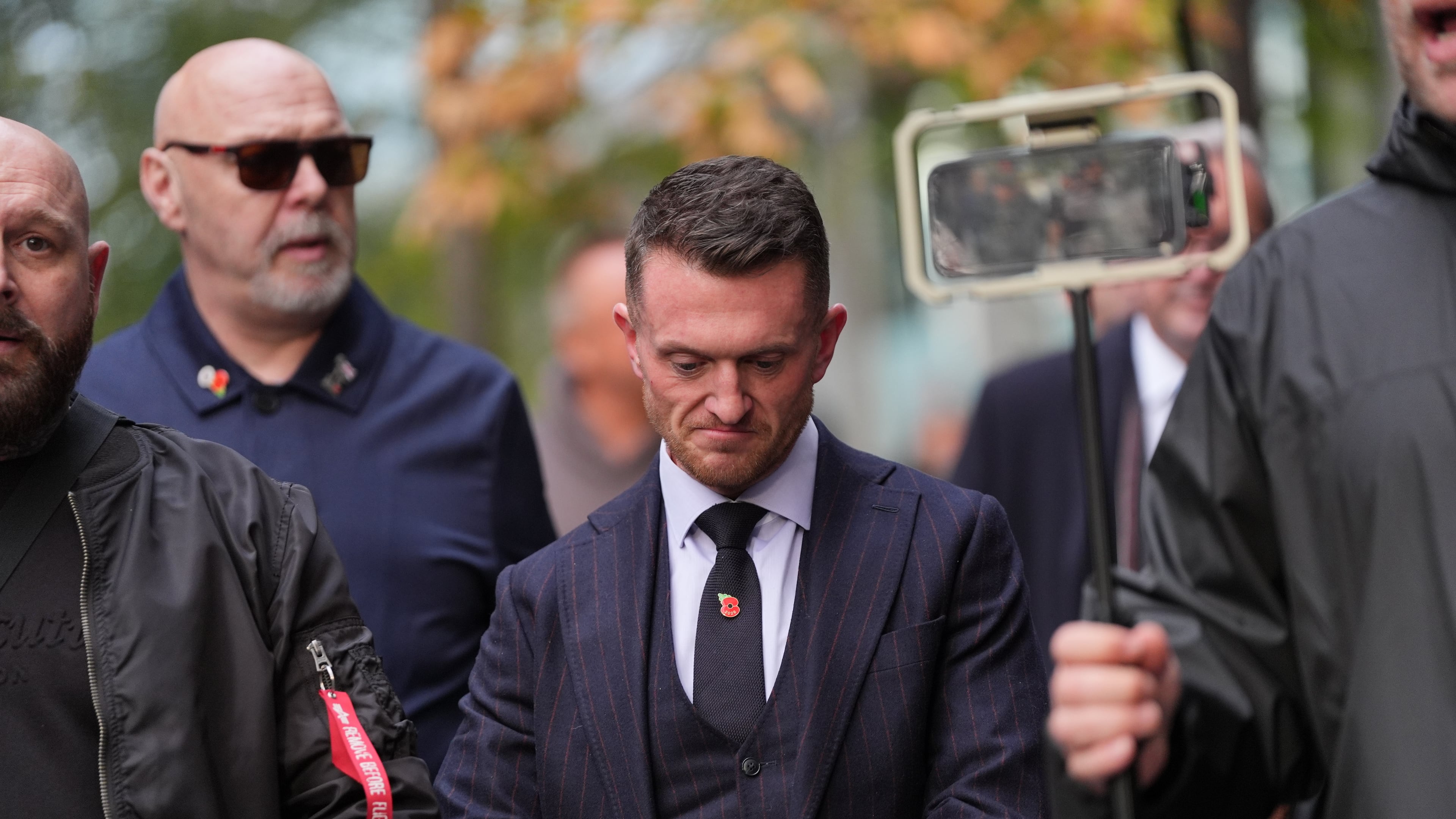 Stephen Yaxley-Lennon, the far-right British activist also known as Tommy Robinson, departs Southwark Crown Court in south London, after he was found guilty of harassing journalists Wednesday, Oct. 28, 2026. (Yui Mok/PA via AP)