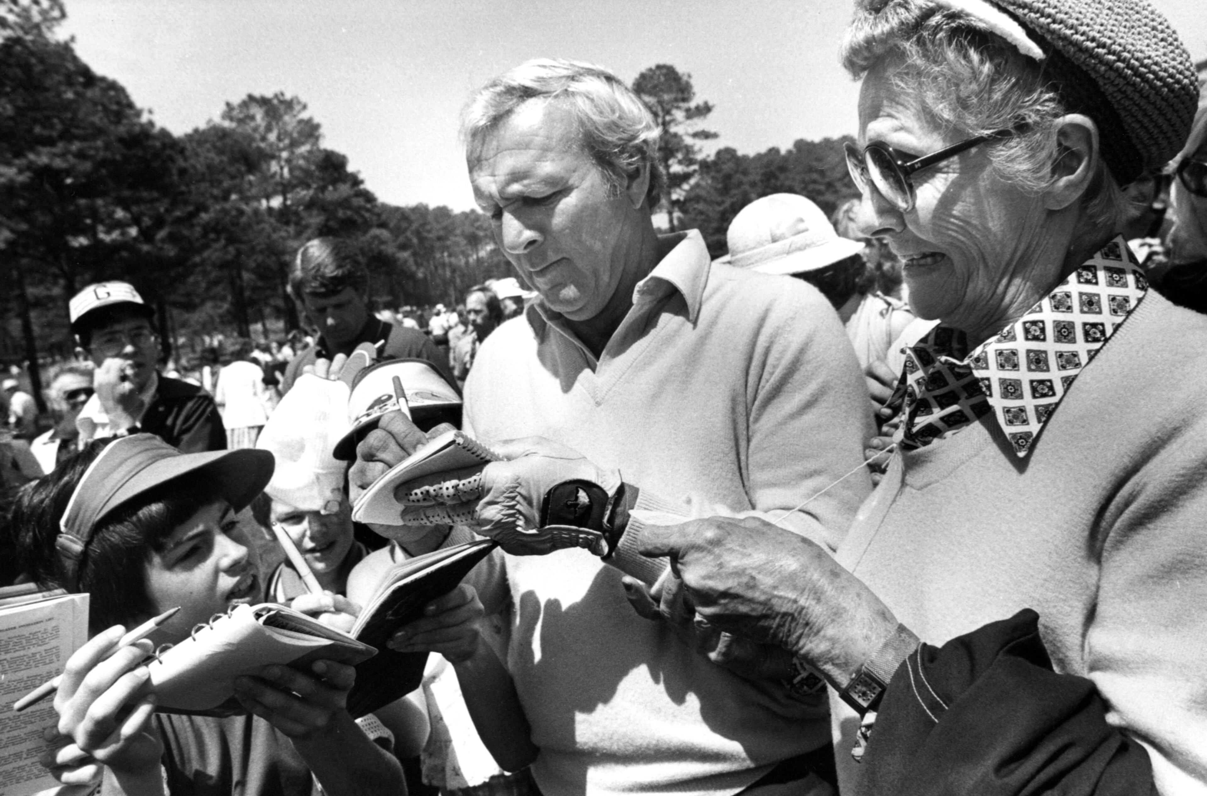 Arnold Palmer signs autographs at the Augusta National Golf Course on Tuesday. April 10, 1979.