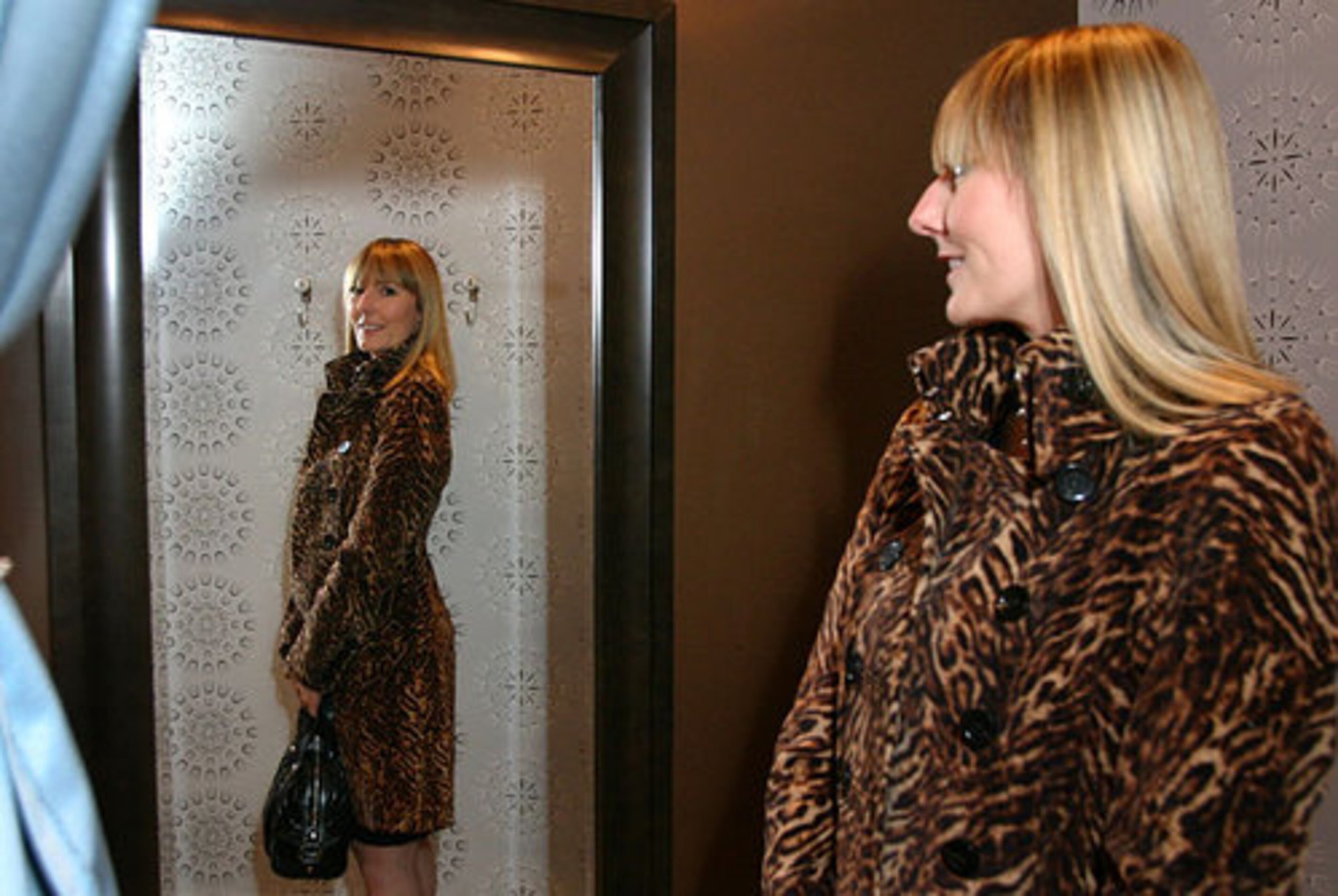 ATLANTA STYLE IS ... : "evolving toward a more big city-like fashion community." Blanco moved to Atlanta from France about 10 years ago and had "style culture shock" here, where comfort trumps fashion. "I have seen oh-so-many women with great figures, hiding in baggy, shapeless, tired clothes." Here, Blanco models her Karen Millen coat.