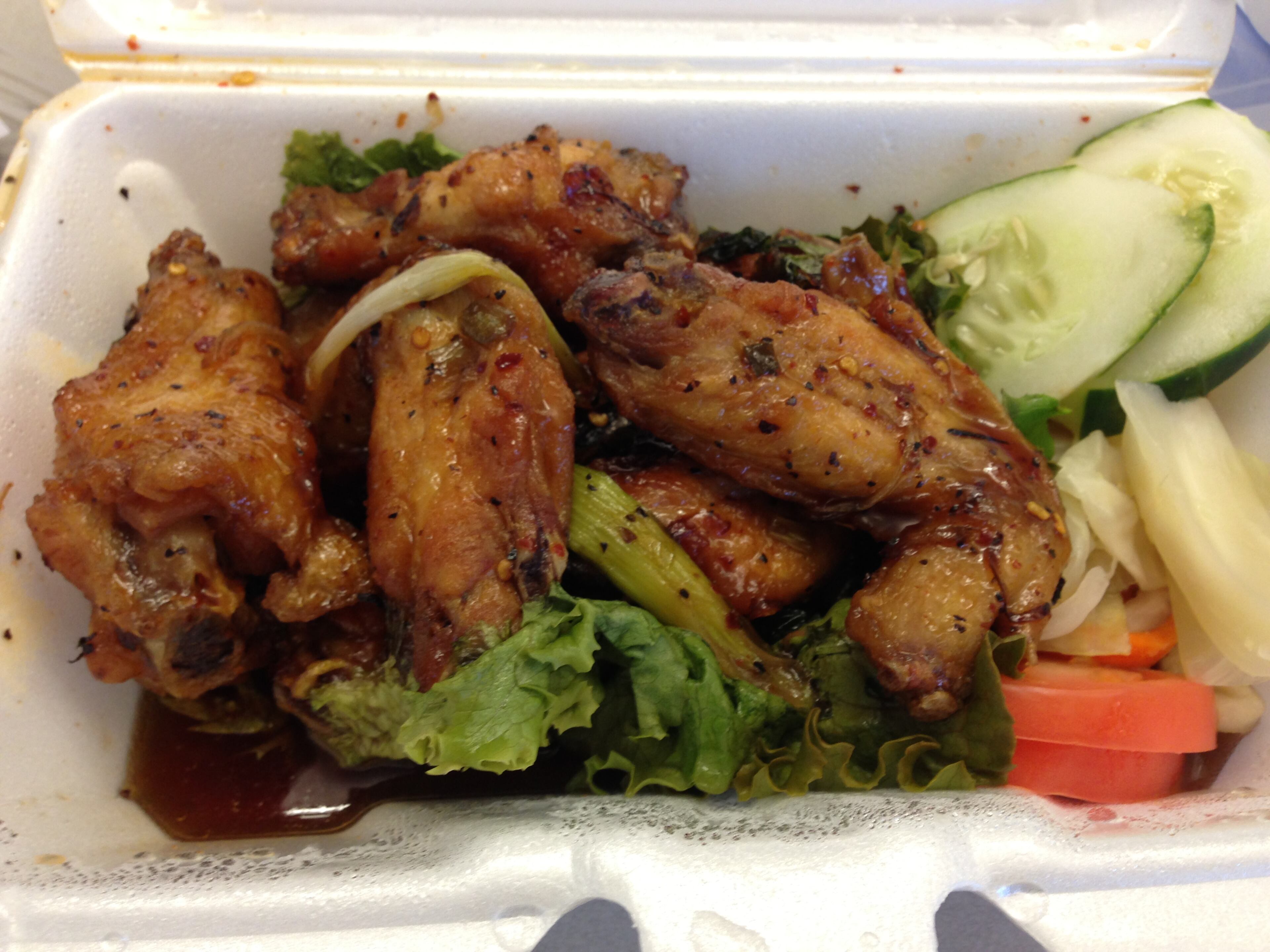 "More of a full meal than an appetizer, this huge portion of wings are flavored to the bone with their salty-sweet marinade, crispy, tossed in a sticky and tangy sauce with cooked scallions and red chiles, then showered with crunchy fried shallots."