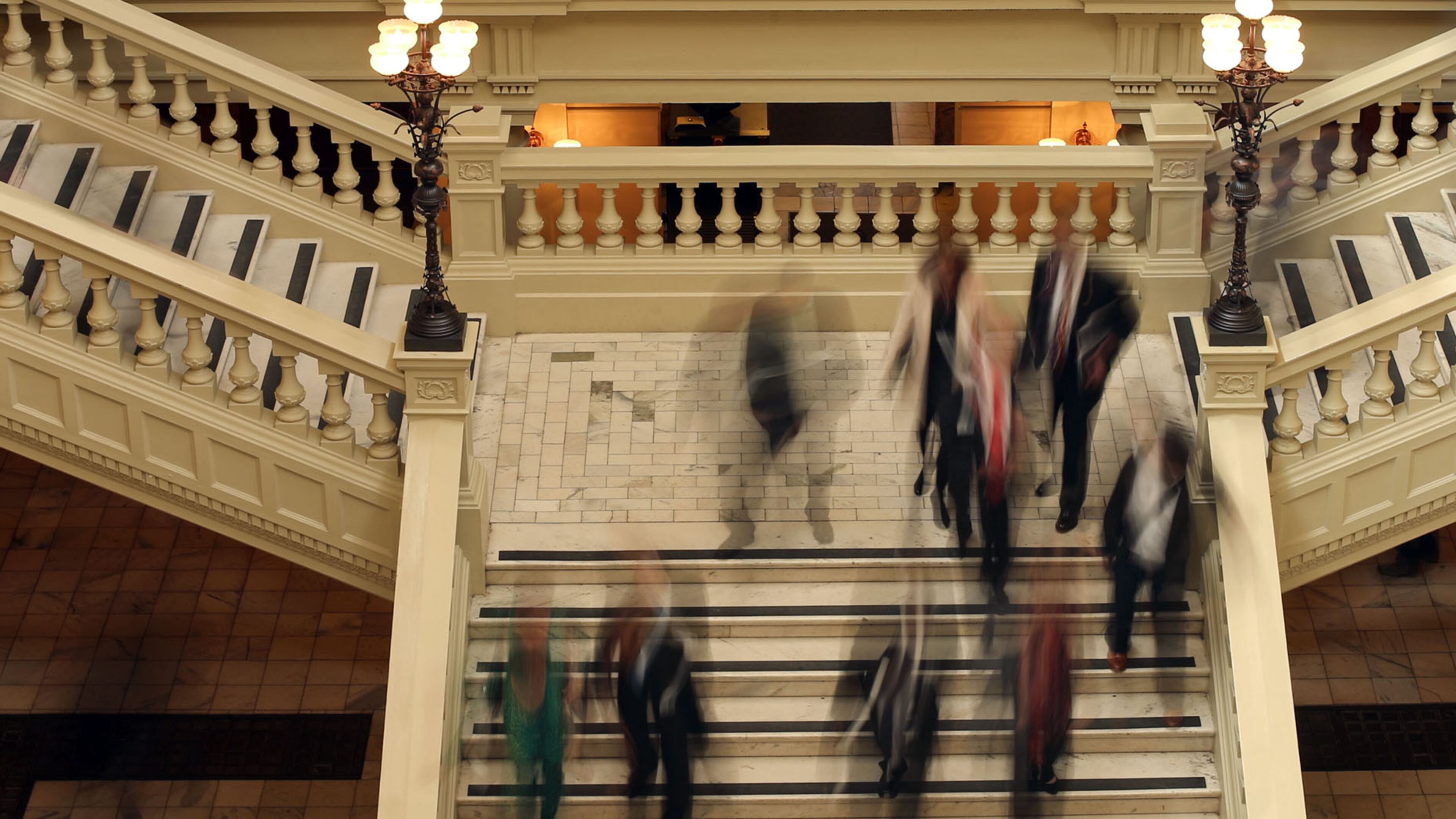 March 25, 2013 - Atlanta, Ga: Lawmakers, lobbyists, and others walk up and down the south staircase of the Capitol during a lunch recession on Legislative Day 38 Monday morning in Atlanta, Ga., March 25, 2013. Monday is the start of the final week of the 2013 Georgia Legislative Session at the Capitol. The final day, Legislative Day 40, or commonly known as, "Sine Die," is on Thursday March 28, 2013. JASON GETZ / JGETZ@AJC.COM