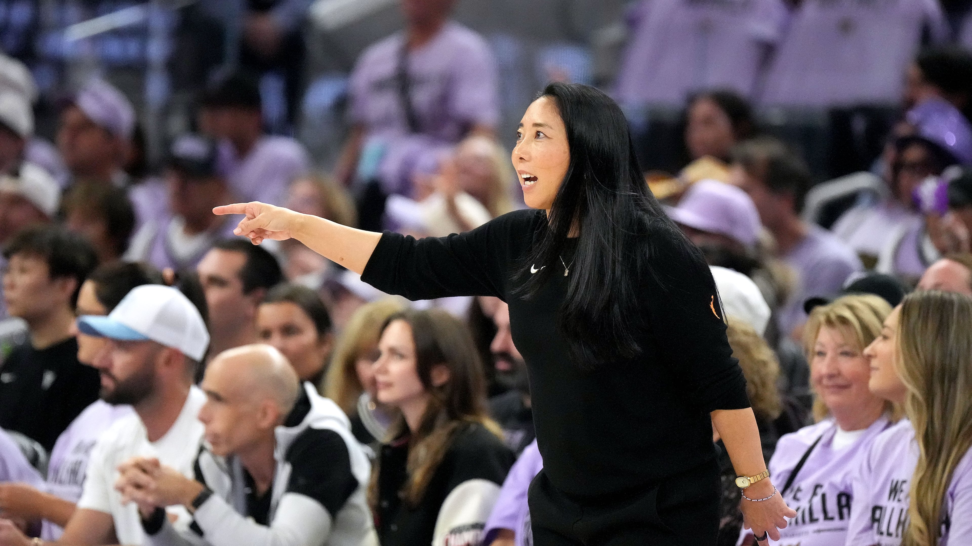 Golden State Valkyries head coach Natalie Nakase, front, talks with her players during the second half of Game 1 of the WNBA basketball semifinals against the Las Vegas Aces in San Francisco, Sunday, Oct. 4, 2026. (AP Photo/Tony Avelar)