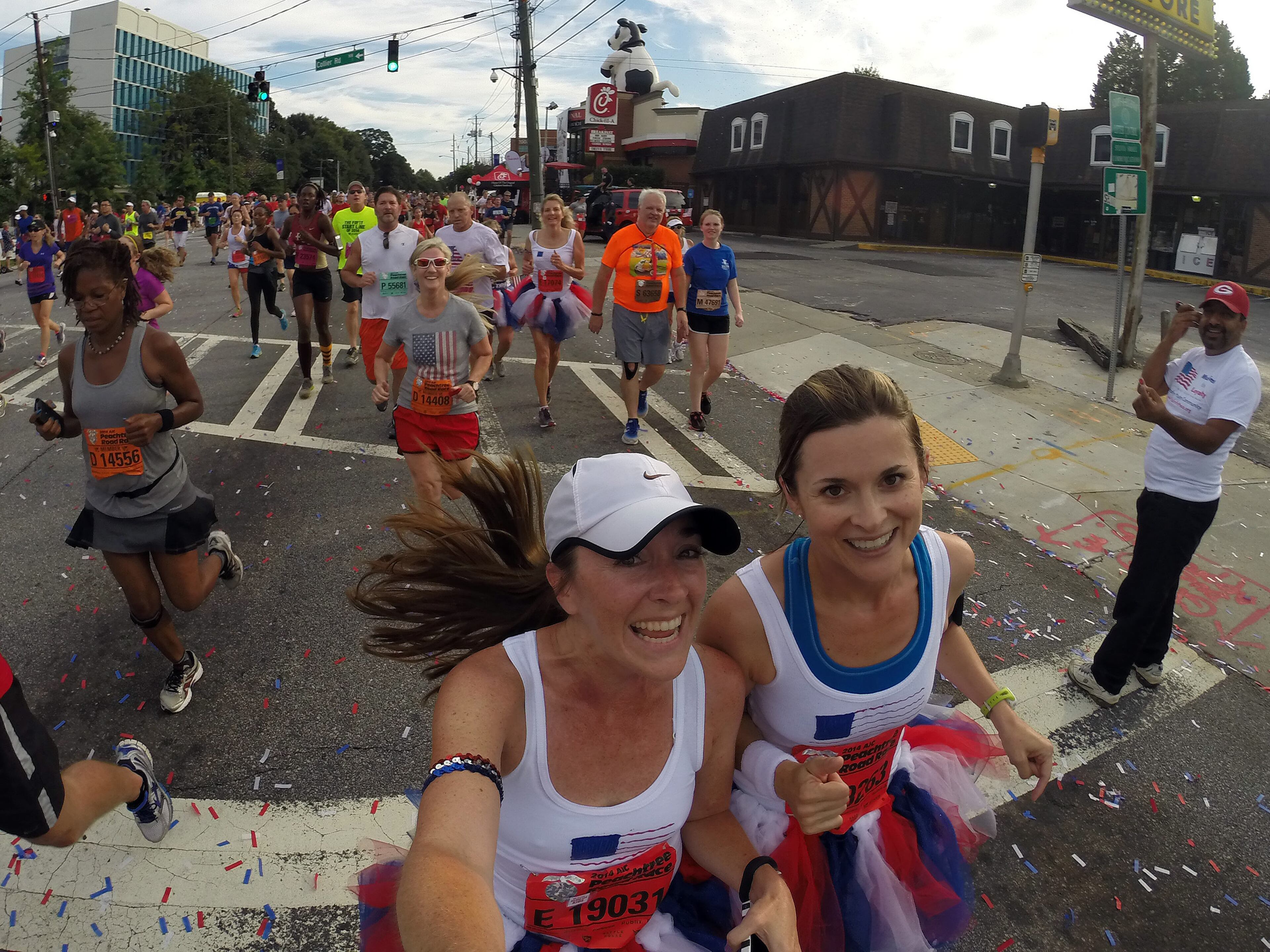 For most people, the AJC Peachtree Road Race is all about getting out and having fun with 60,000 other revelers. With that in mind, AJC Photojournalist Ben Gray passed a camera to runners as he made his way South on Friday morning July 4, 2014 and shot "selfies" of the runners as they carried the camera. BEN GRAY / BGRAY@AJC.COM