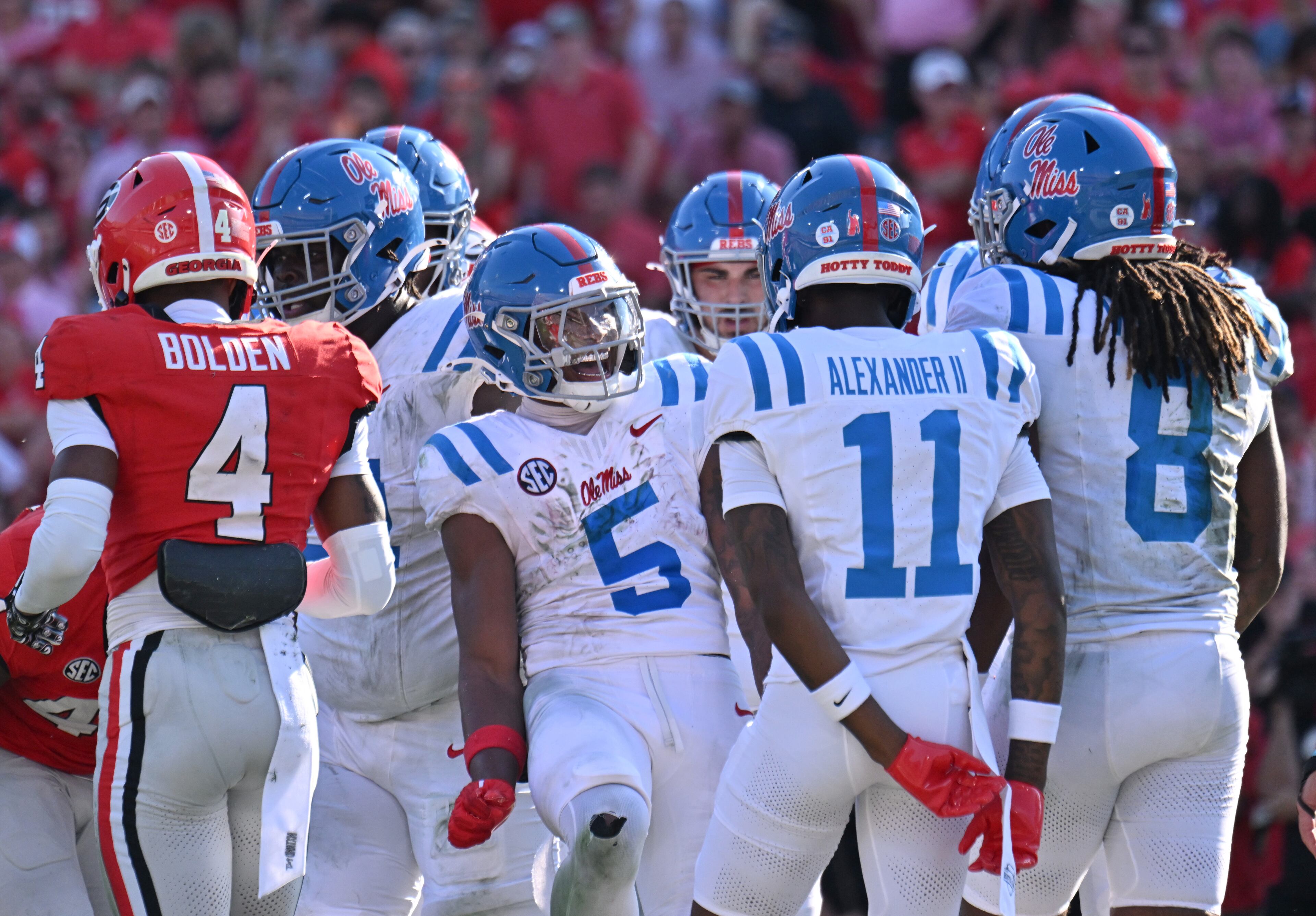 Mississippi defensive end Kam Franklin (center) celebrates after scoring a touchdown catch during the first half in an NCAA football game at Sanford Stadium, Saturday, Oct. 18, 2025, in Athens. (Hyosub Shin/AJC)