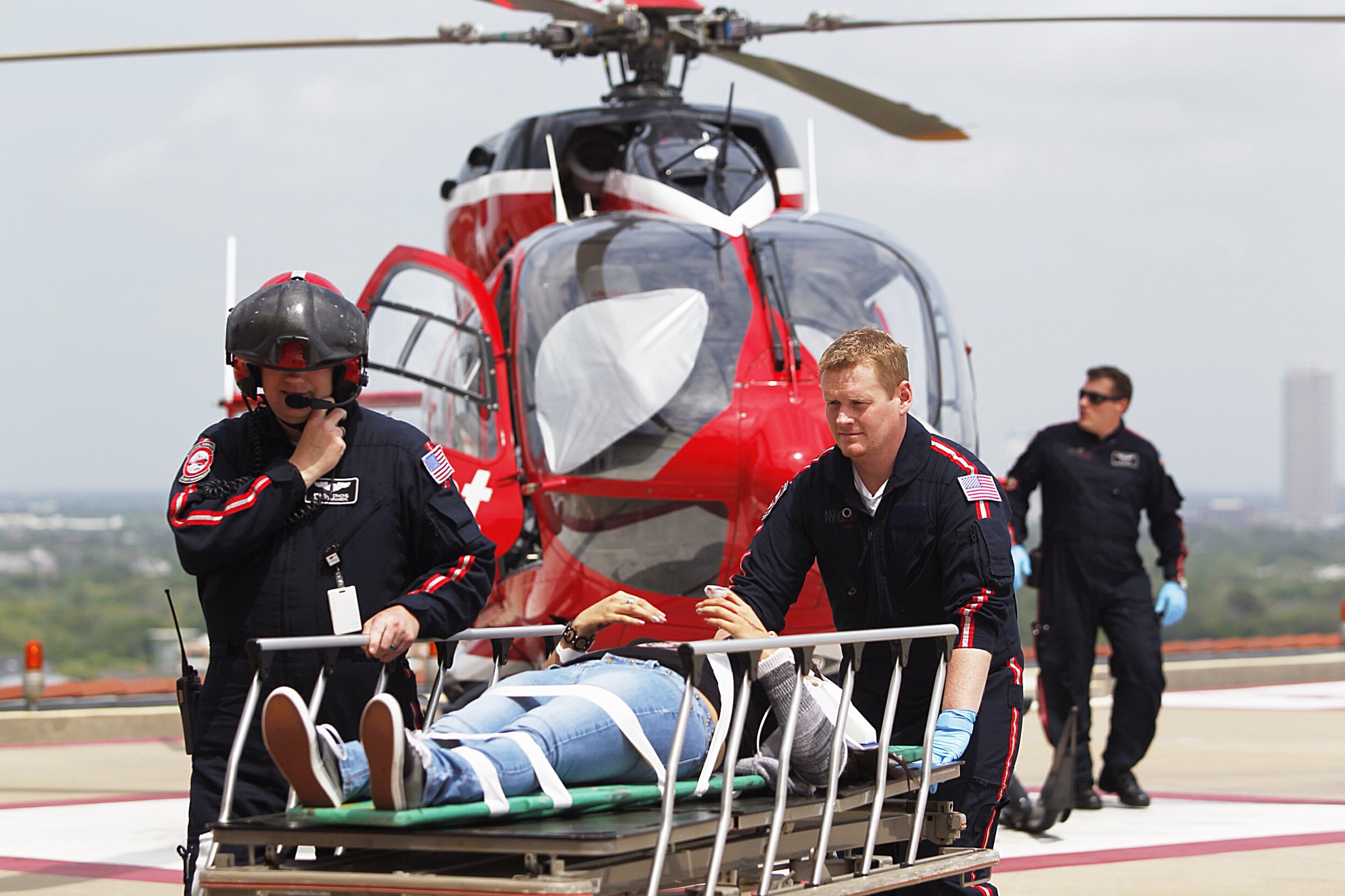 Life Flight personnel rush a victim wounded in a stabbing attack on the Lone Star community college system's Cypress, Texas, campus into Memorial Hermann Hospital.