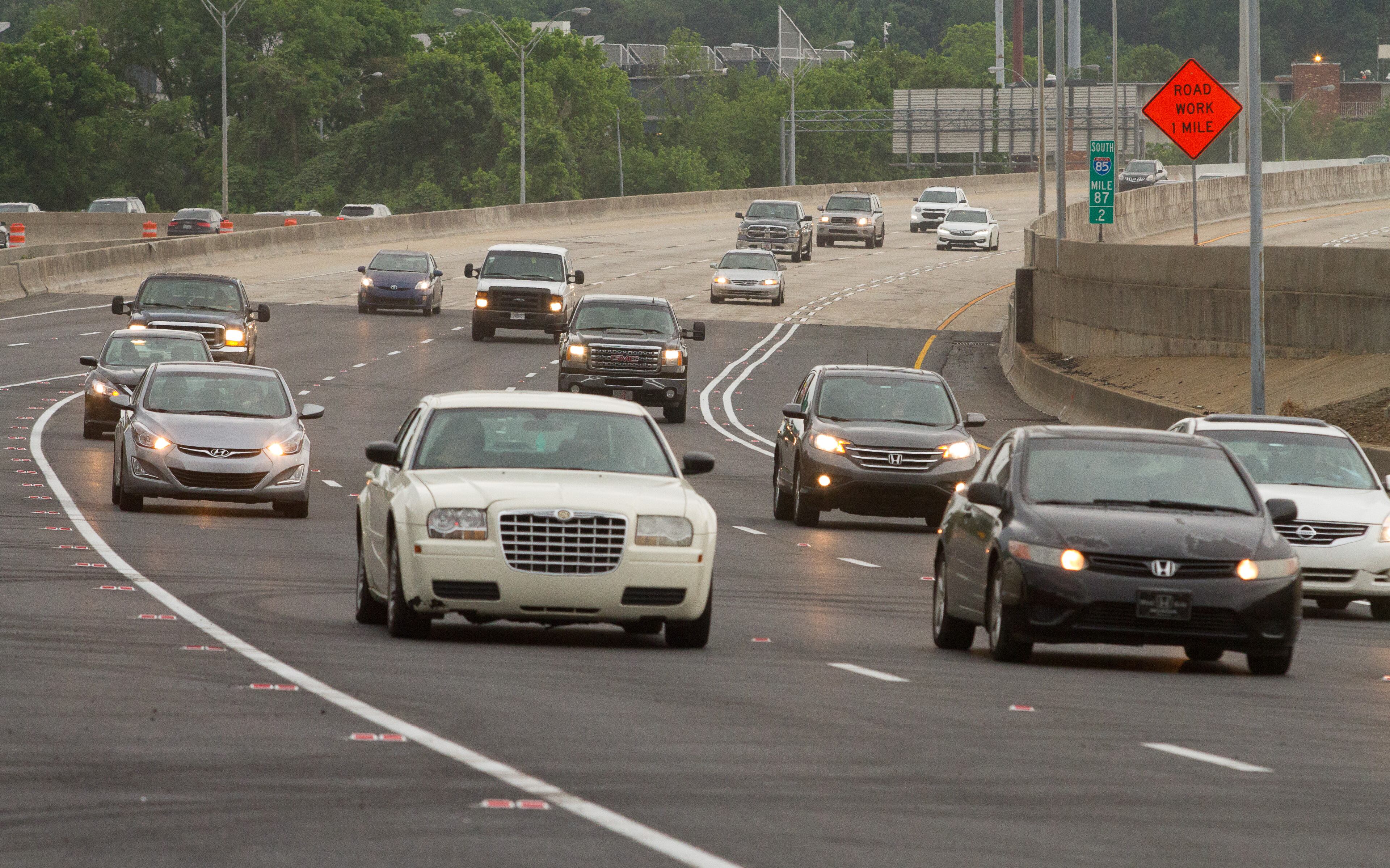 Cars drive over the recently opened northbound lanes of I-85 in Atlanta GA. Friday evening, May 12, 2017. STEVE SCHAEFER / SPECIAL TO THE AJC