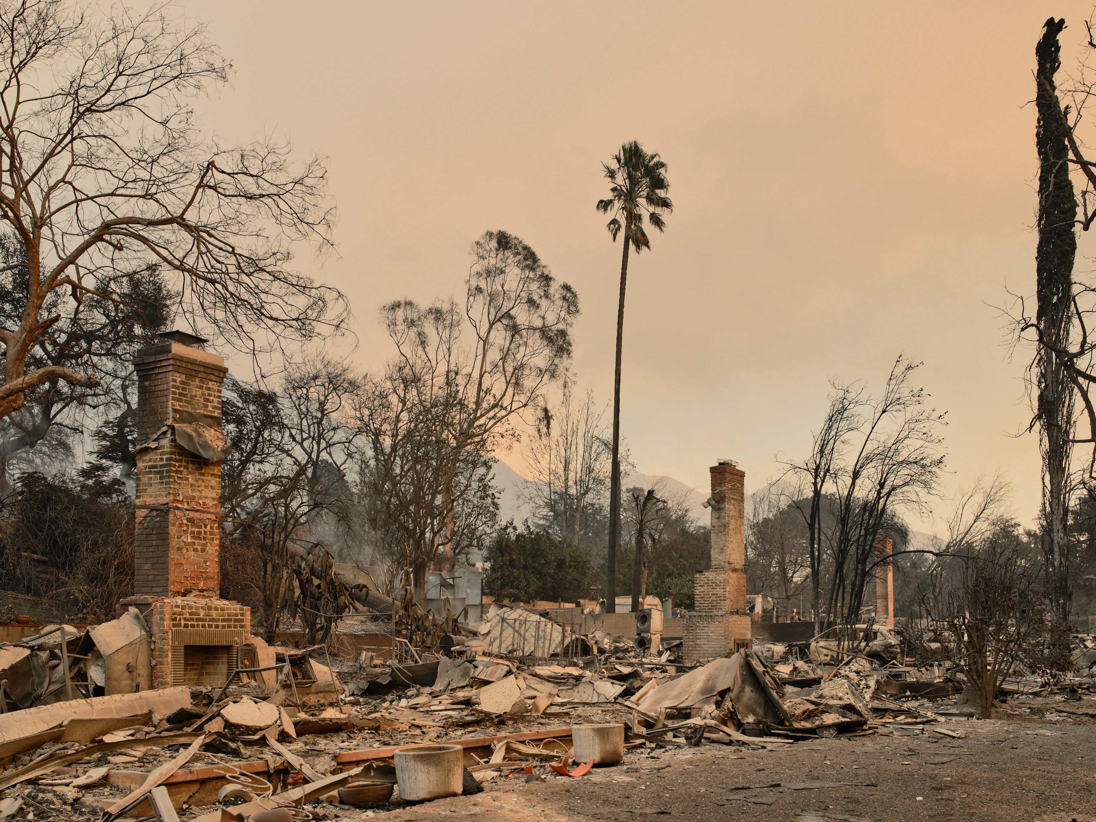 Destroyed homes on East Las Flores Drive amid the Eaton fire in Altadena, Calif., on Thursday, Jan. 9, 2025. The most destructive fires in the history of Los Angeles still raged Thursday, after killing at least five people and destroying at least 2,000 structures. (Philip Cheung/The New York Times)
