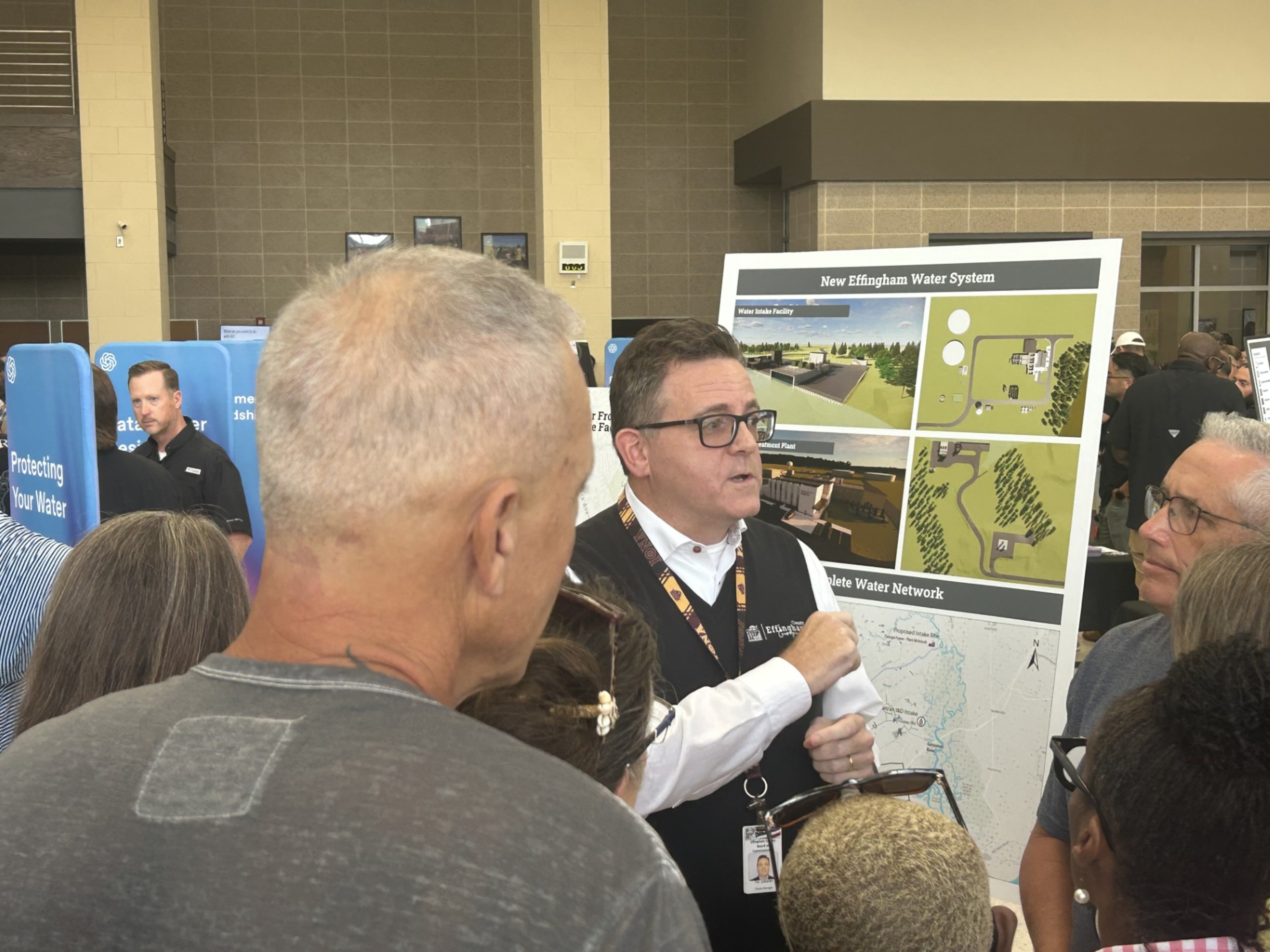Effingham County administrator Tim Callanan speaks to concerned residents during OpenAI’s data center open house. The project was announced less than 36 hours before Thursday’s meeting. (Adam Van Brimmer/AJC)