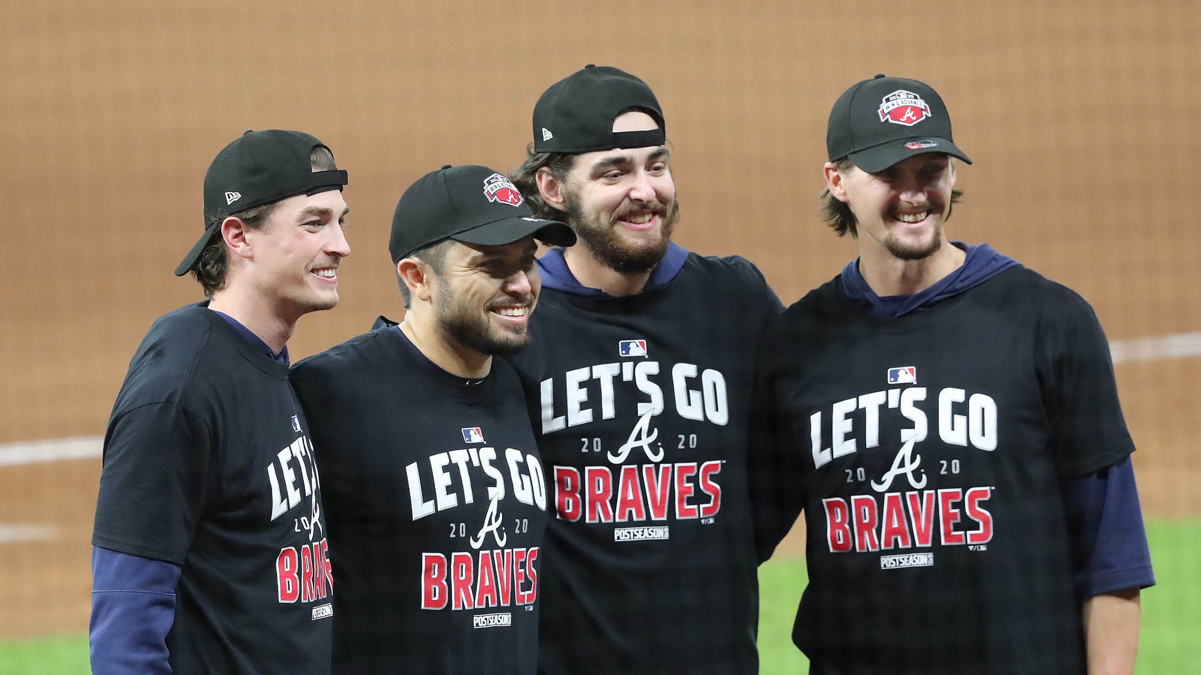 Atlanta Braves starting pitchers Max Fried (from left), catcher Travis d’Arnaud, Ian Anderson, and Kyle Wright celebrate advancing to the NL Championship Series by defeating the Marlins 7-0 in Game 3 of the NLDS completing their second consecutive postseason series sweep on Thursday, Oct 8, 2020 in Houston. “Curtis Compton / Curtis.Compton@ajc.com”