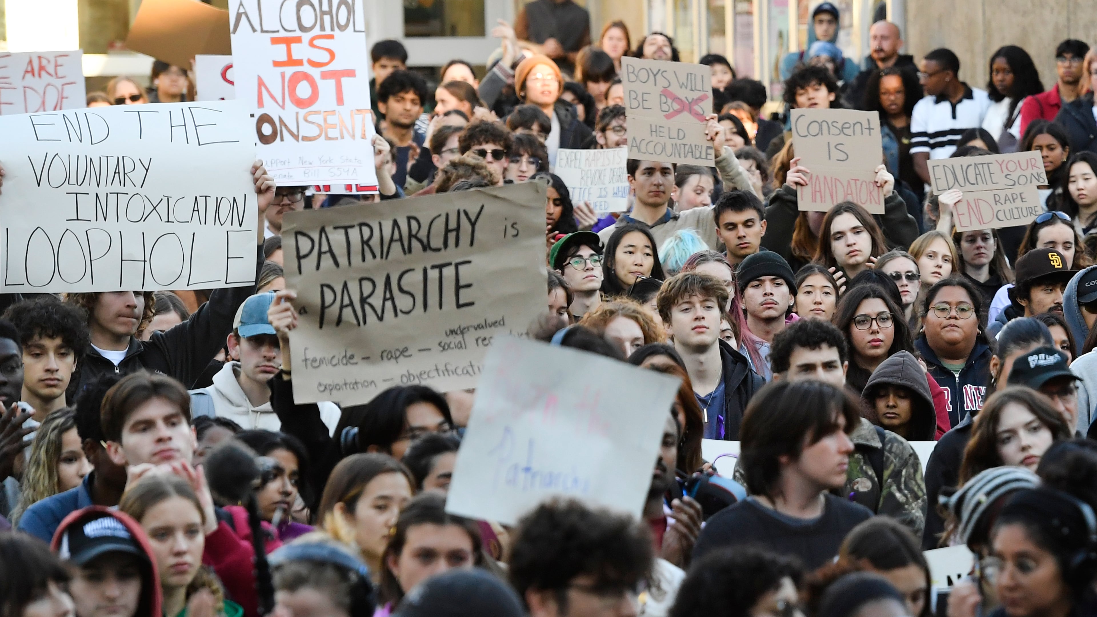 Demonstrators attend a protest against Cornell University's handling of the 2024 fraternity-house gang rape allegations at the campus, Monday, Oct. 5, 2026, in Ithaca, N.Y. (AP Photo/Adrian Kraus)