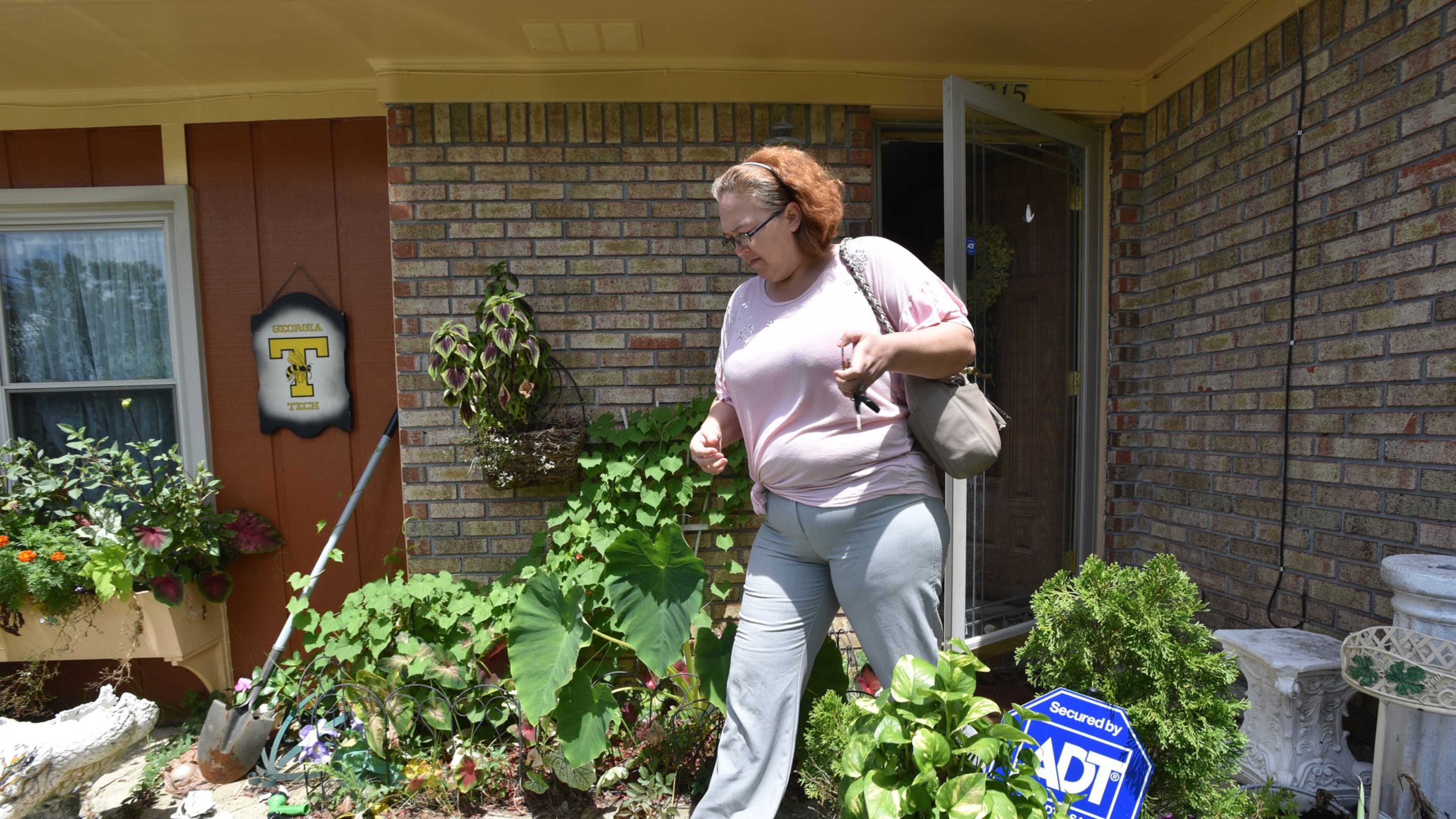 Jammie Duvall leaves her home in Columbus earlier this month. Duvall, a former cafeteria worker at West Central Georgia Hospital, said that after she reported that a warehouse worker was repeatedly making sexually explicit comments to her, a supervisor shrugged off the complaint. HYOSUB SHIN / HSHIN@AJC.COM