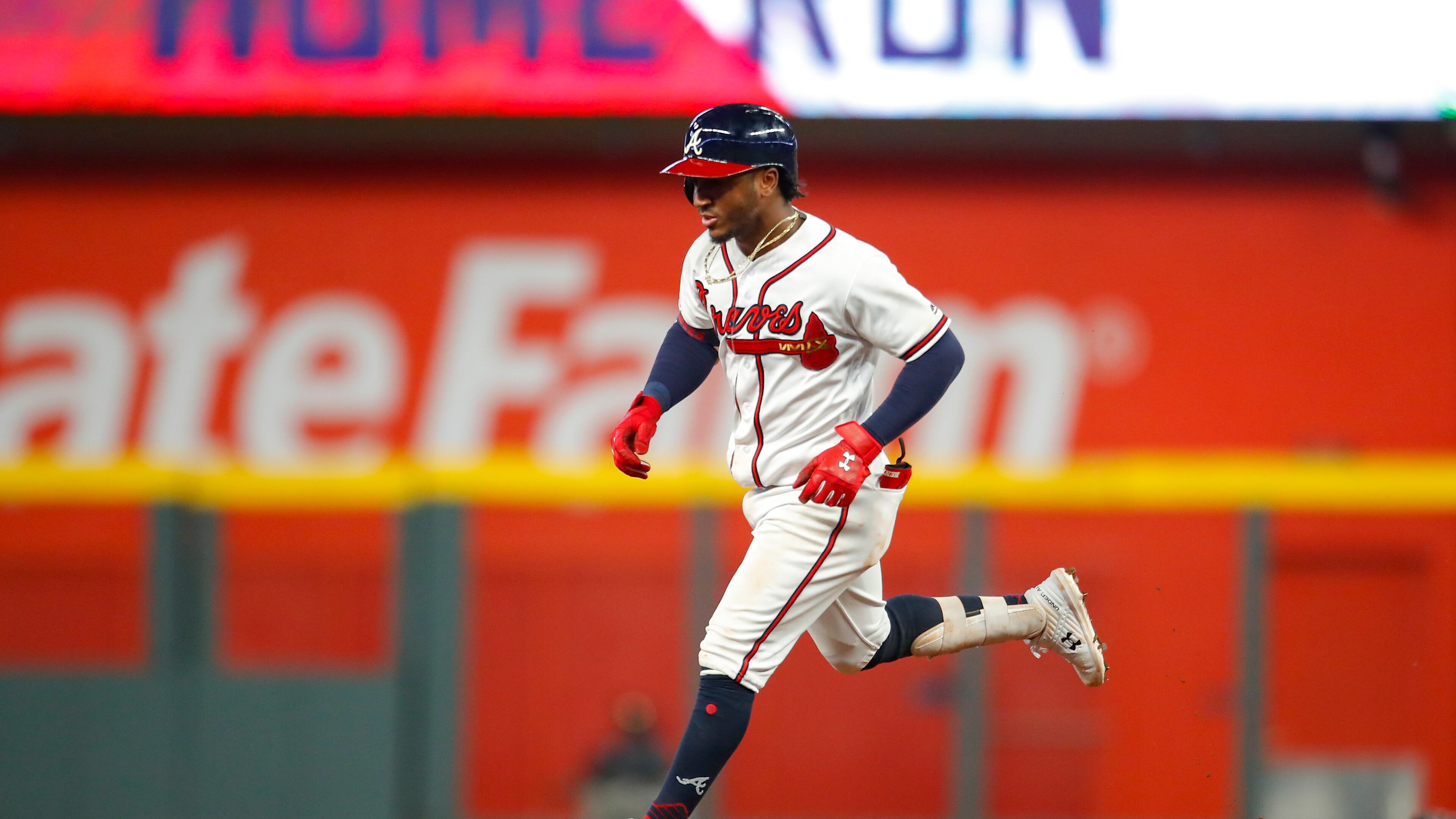 Braves infielder Ozzie Albies rounds second after a home run during Monday's 13-7 victory over the Pirates at SunTrust Park. The Braves hit five home runs in the victory which also included the early ejection of Braves third baseman Josh Donaldson. (Photo by Todd Kirkland/Getty Images)