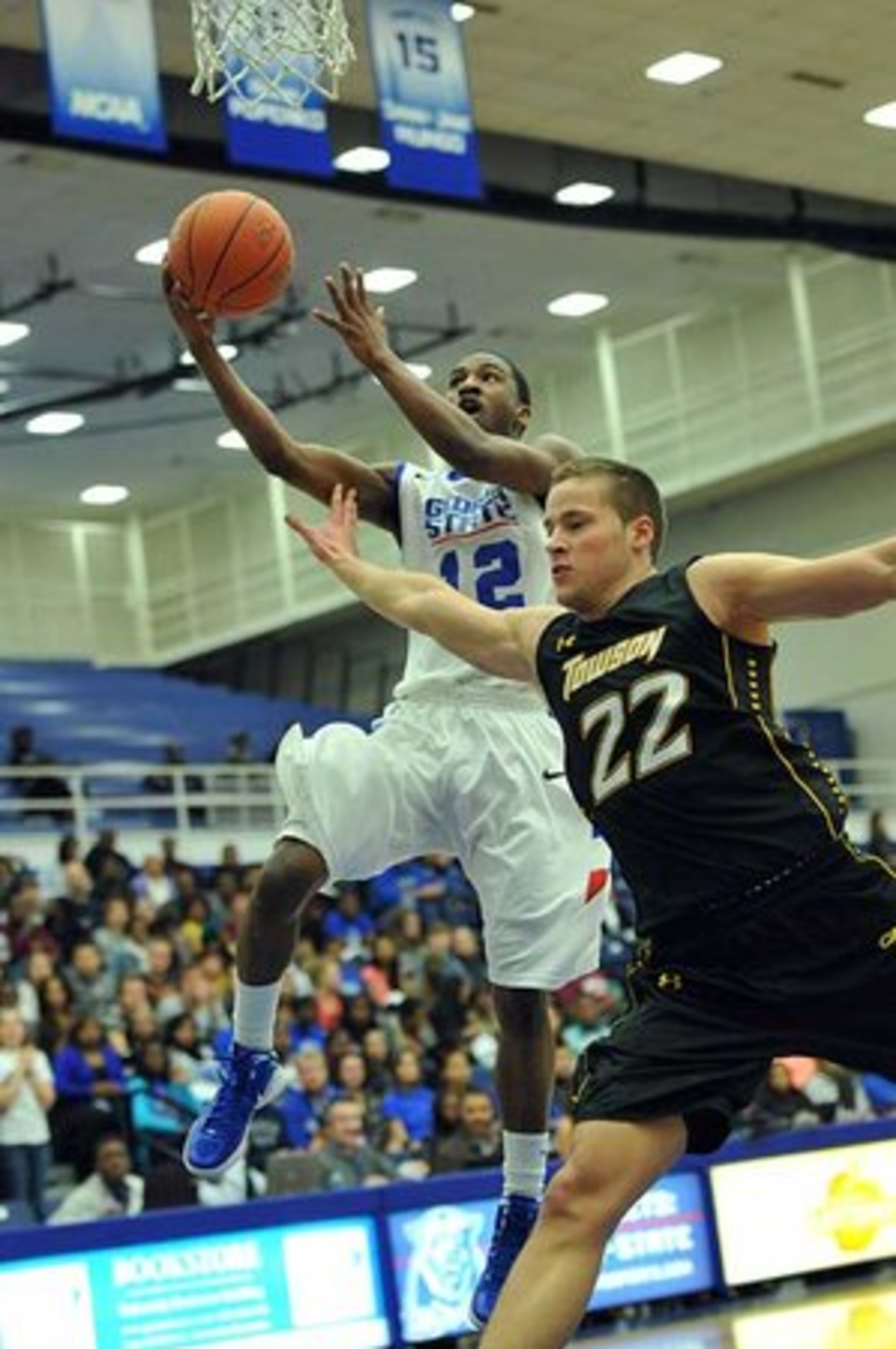Georgia State guard Devonta White goes to the basket as Towson forward Alex Giergen tries to block in the first half at GSU Sports Arena in Atlanta on Saturday, January 14, 2011. GSU defeated Towson 57-42.