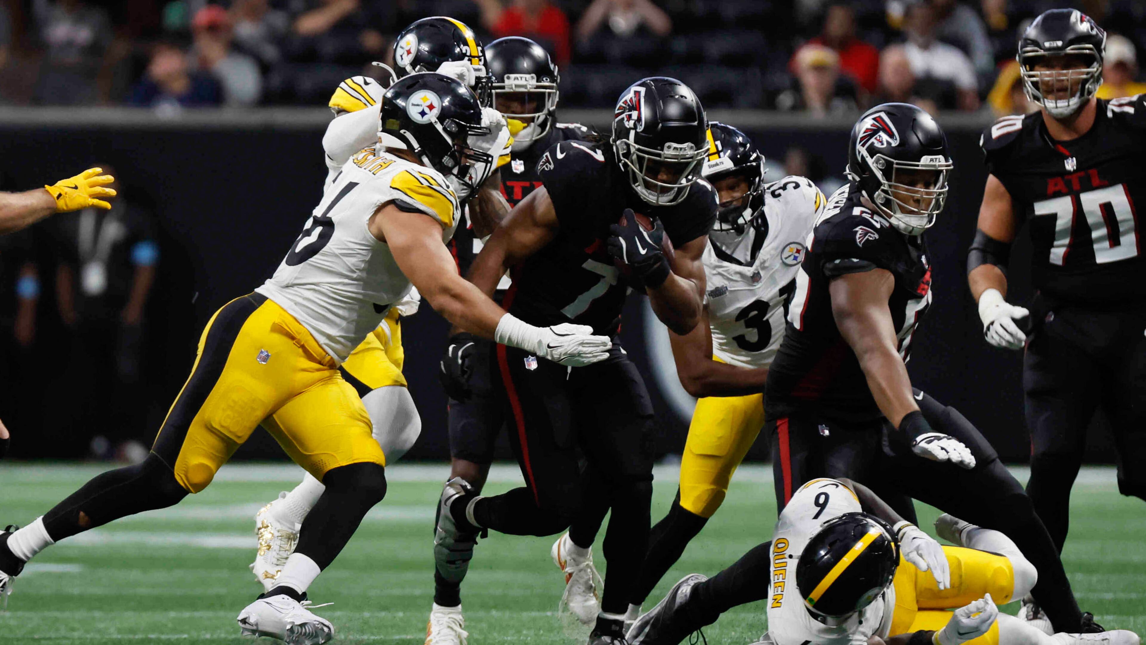 Atlanta Falcons running back Bijan Robinson (7) breaks a tackle during the second half of an NFL football game against the Pittsburgh Steelers on Sunday, Sept. 8, at Mercedes-Benz Stadium in Atlanta.
(Miguel Martinez/ AJC)