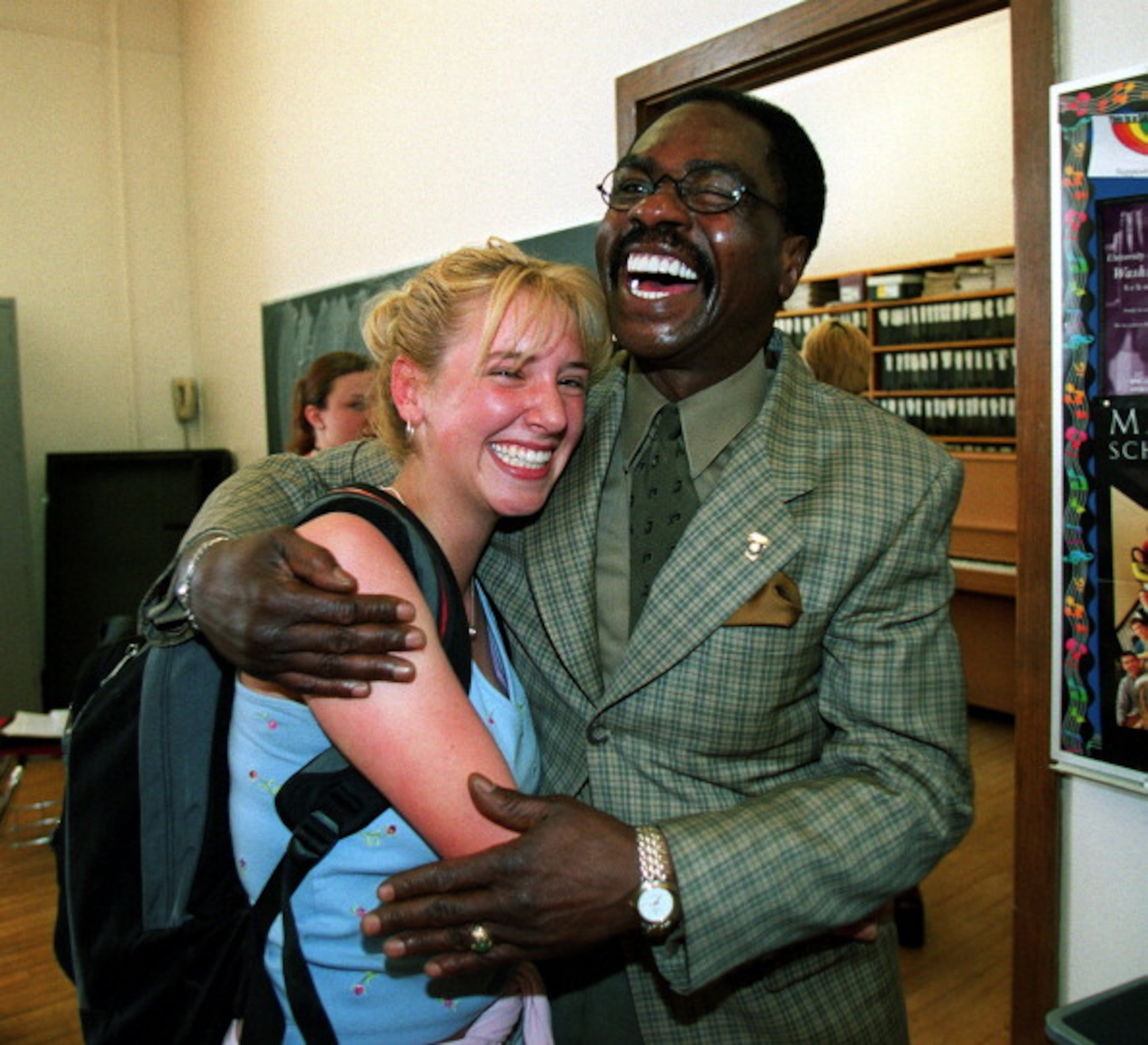 Rubin 'Hurricane' Carter gives a hug to student Alison Peters, sophomore, after a talk hegave to a group of students as part of the East High School PTSA Community Forum. Carter is the featured speaker at the annual East High School Parent Teacher Student Association's Community Forum on Friday. (Photo By John Leyba/The Denver Post via Getty Images)