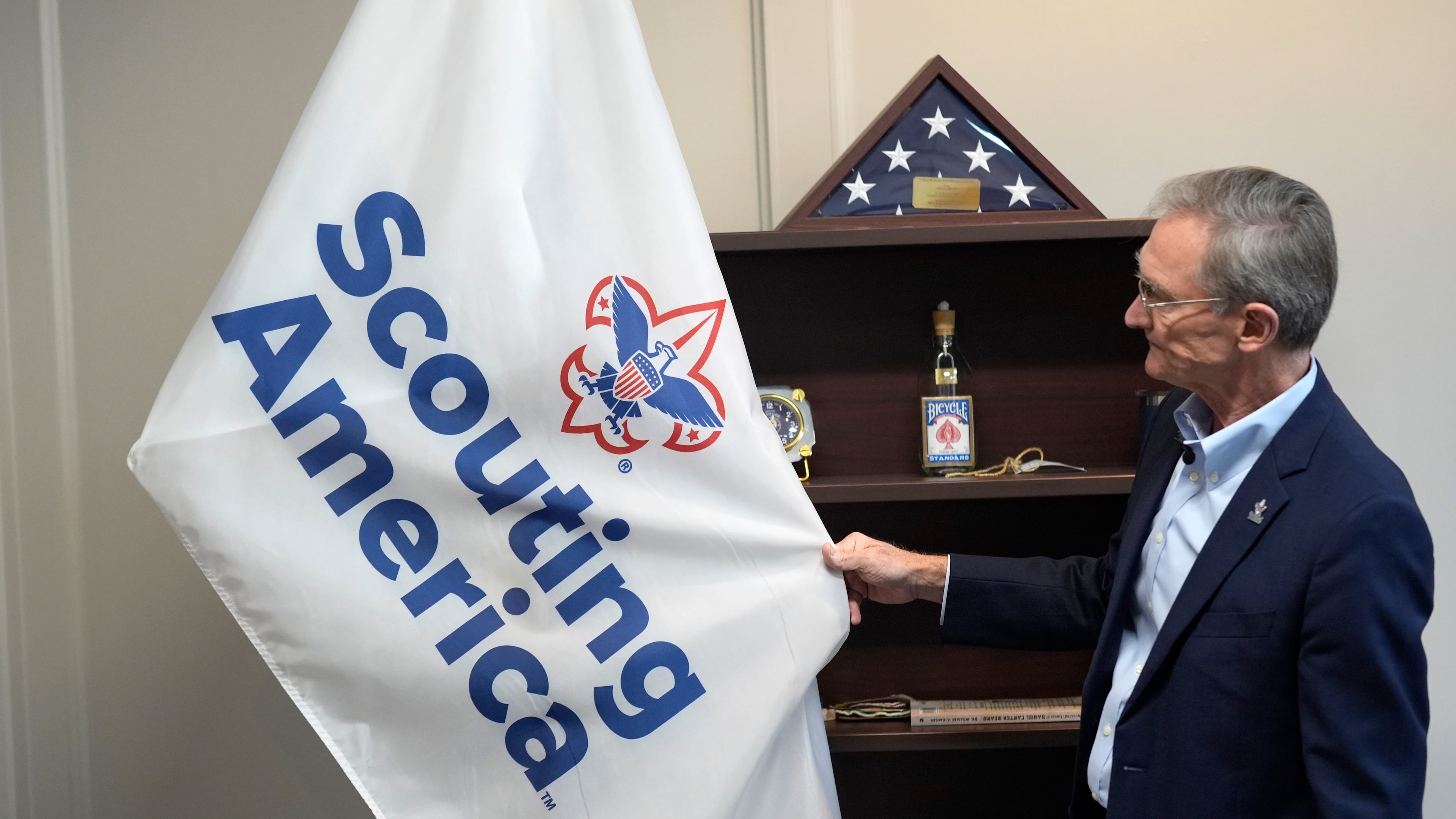 FILE - Roger Krone, chief executive officer of Scouting America, describes the design of the organization's flag in Irving, Texas, Feb. 5, 2025. (AP Photo/LM Otero, File)