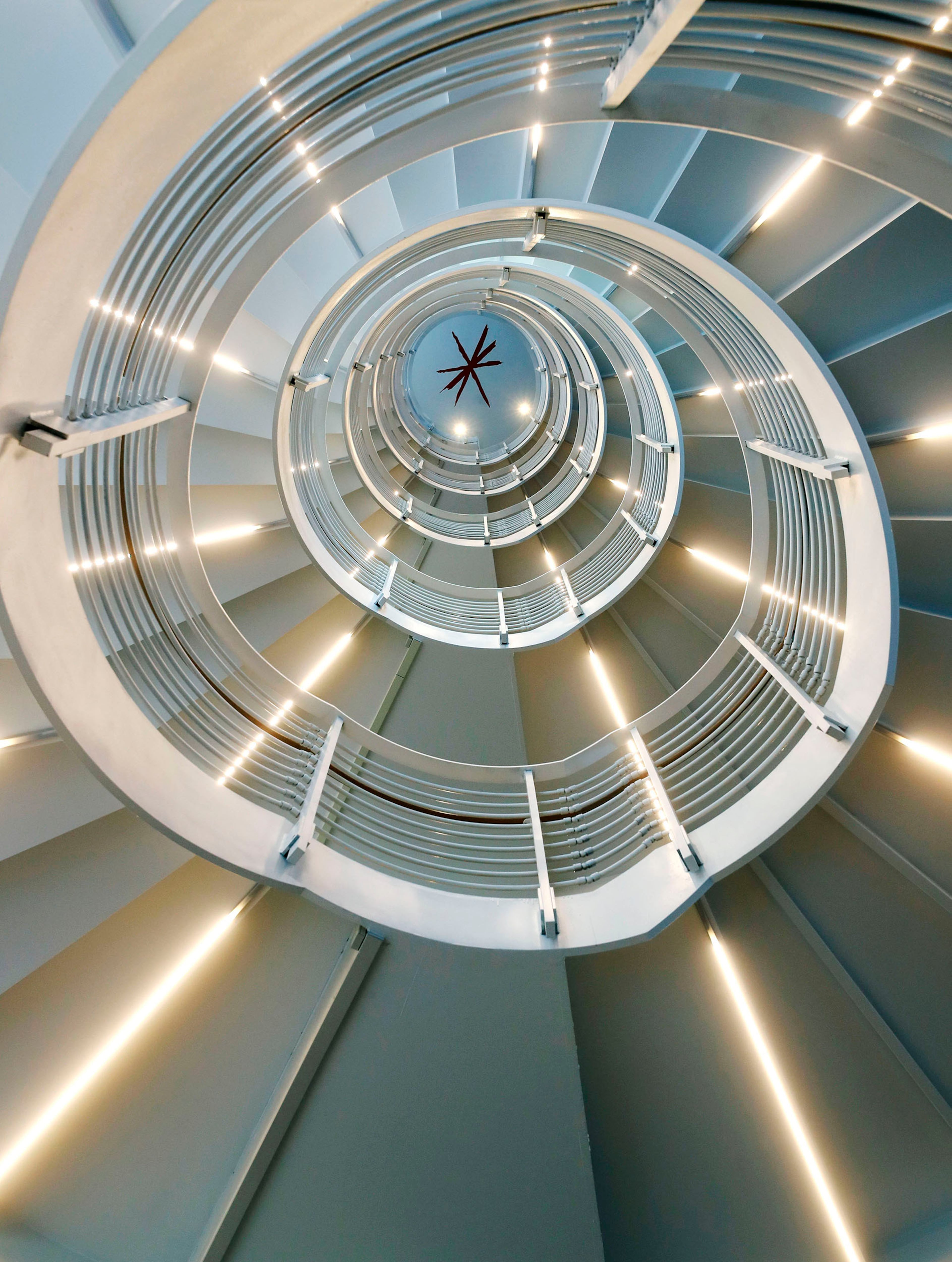 At the top of the spiral staircase in the collaborative core, viewed from the bottom, is John Portman's "spark", which he used in his signature. The staircase at the Coda project at Georgia Tech is thought to be the longest spiral staircase in the world. The Coda project at Georgia Tech is slated to open in early May.