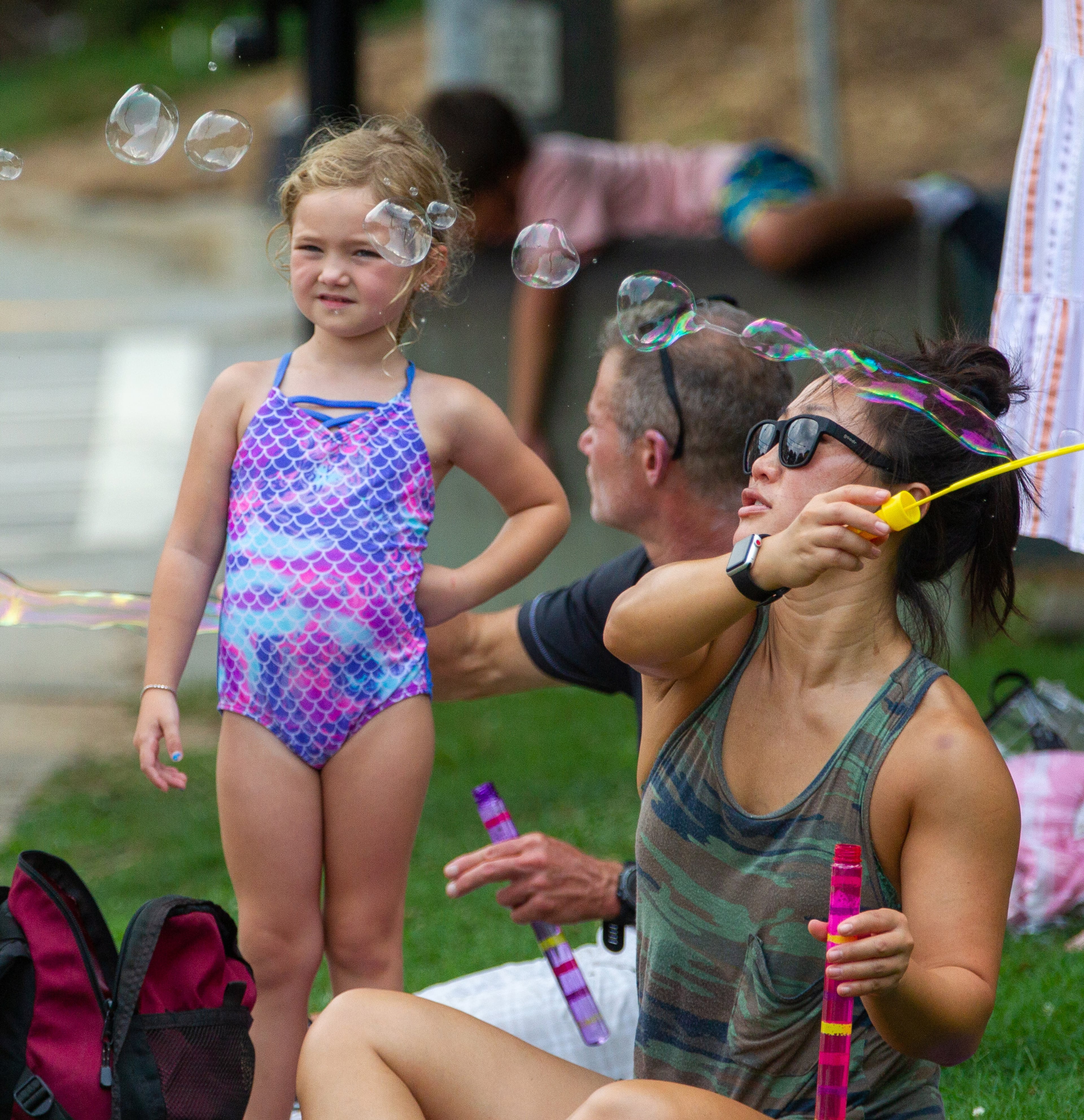 Vanesa Griffin makes bubbles during the Brookhaven Cherry Blossom Festival on Saturday, July 31, 2021. STEVE SCHAEFER FOR THE ATLANTA JOURNAL-CONSTITUTION