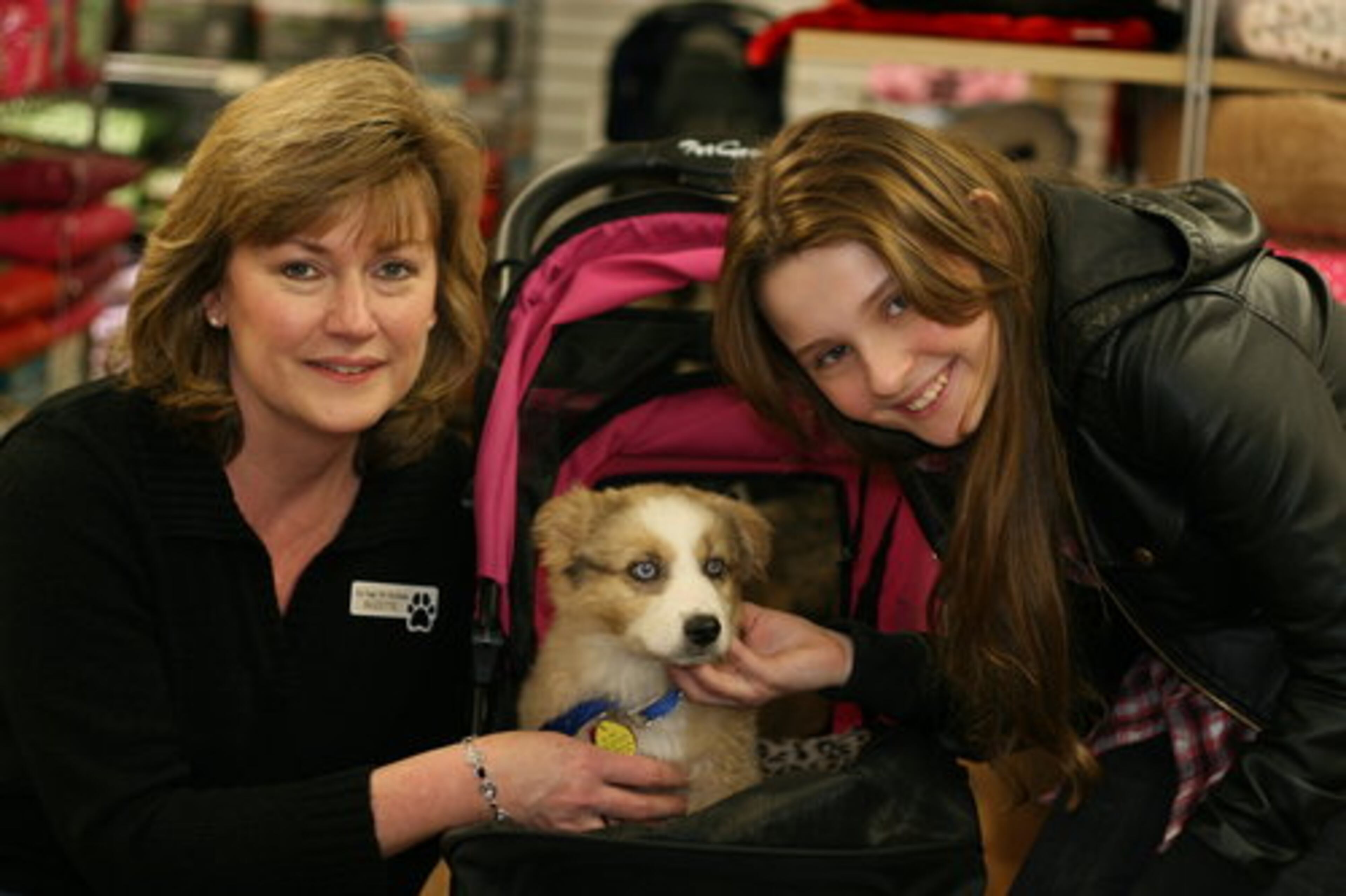 Here's Top Dog Pet Boutique store owner Suzette Lindsey with Abigail and Andalucia.
