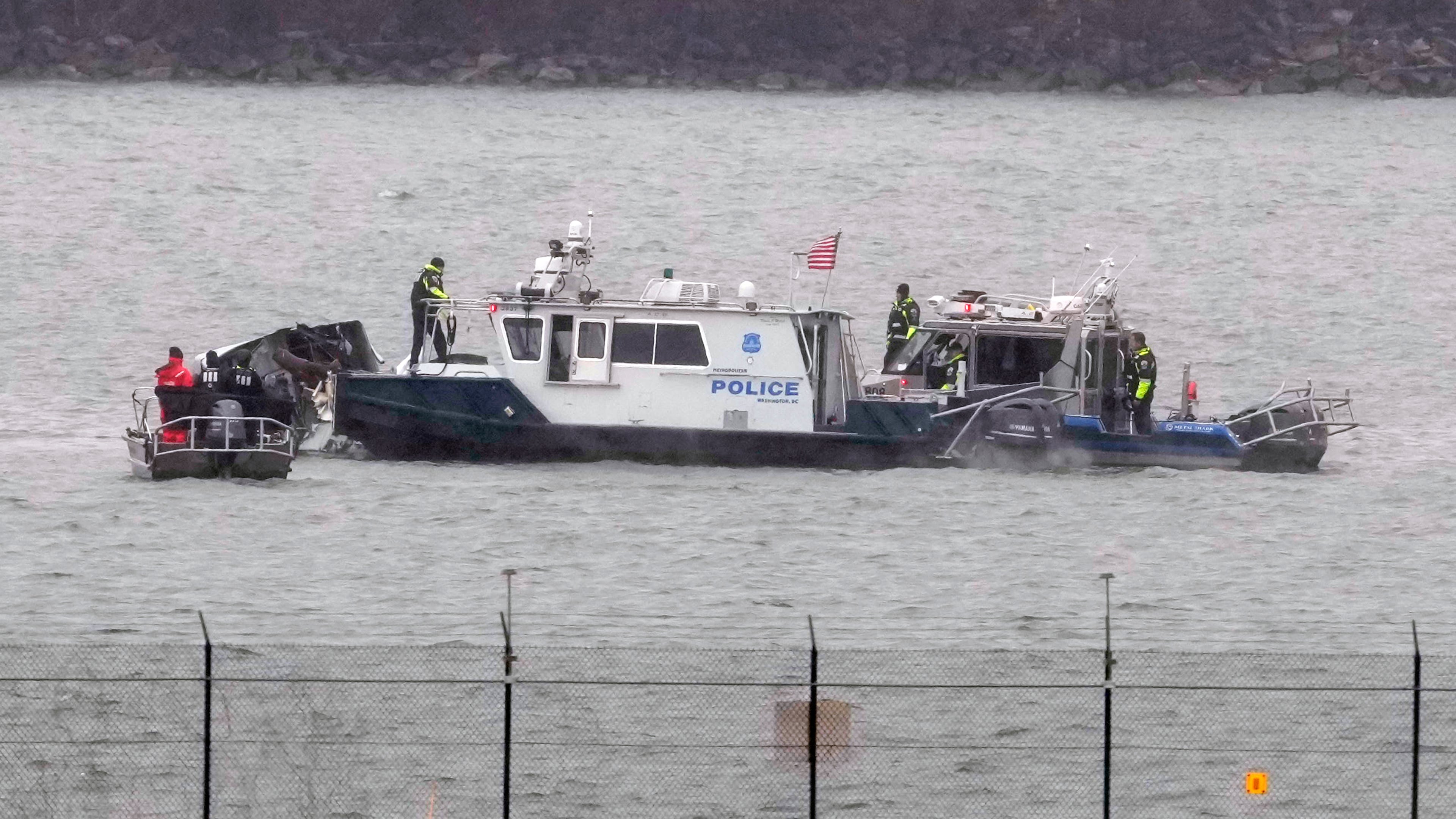 FILE - Search efforts are seen around a wreckage site of a deadly midair collision between an American Airlines jet and an Army helicopter in the Potomac River near Ronald Reagan Washington National Airport, Jan. 31, 2025, in Arlington, Va. (AP Photo/Alex Brandon, File)