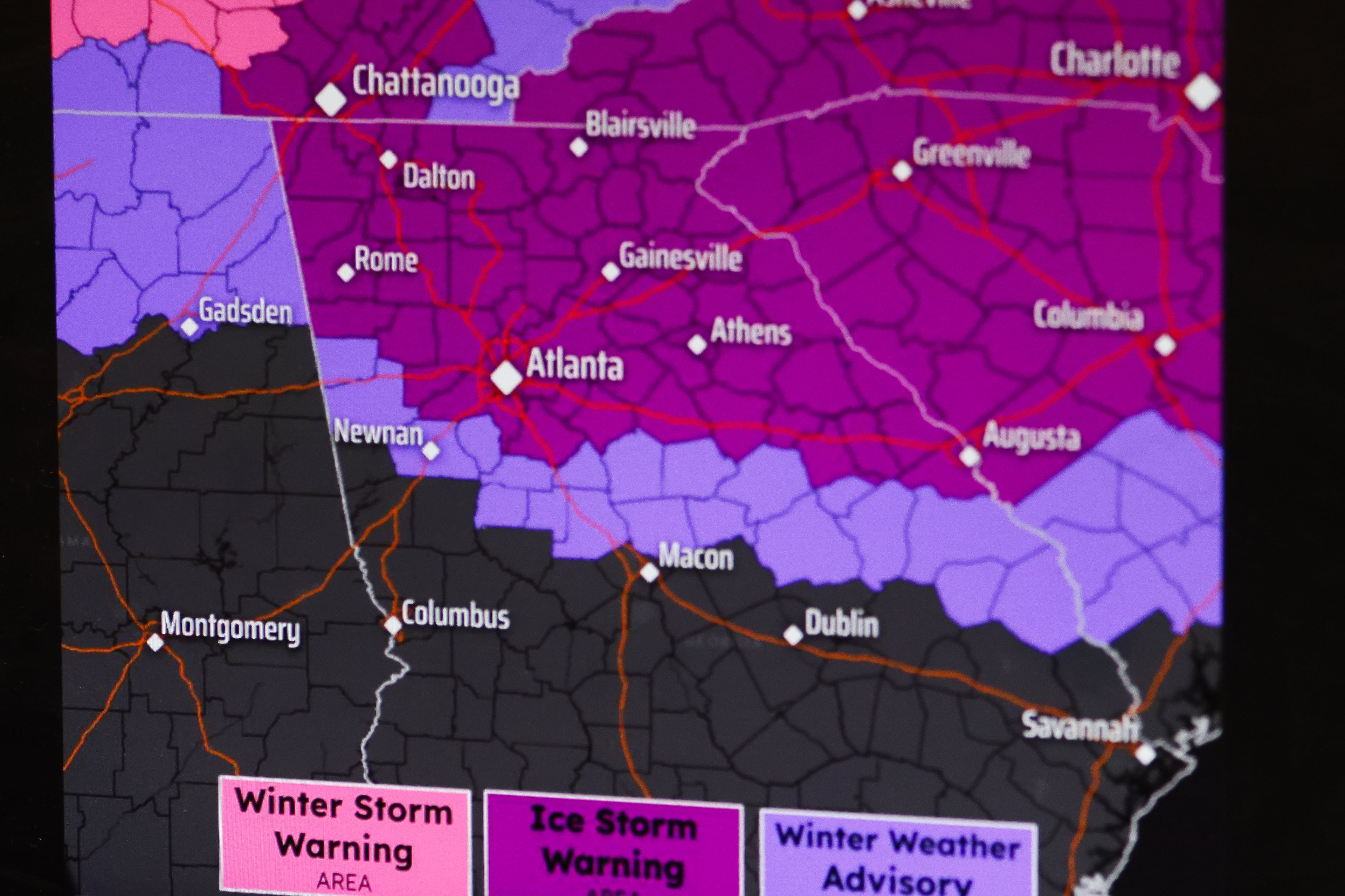 An ice storm warning is issued for Atlanta during a press conference at the Georgia Emergency Management Agency State Operations Center in Atlanta on Saturday, Jan. 24, 2026. The map shows the winter storm and ice storm warning areas.