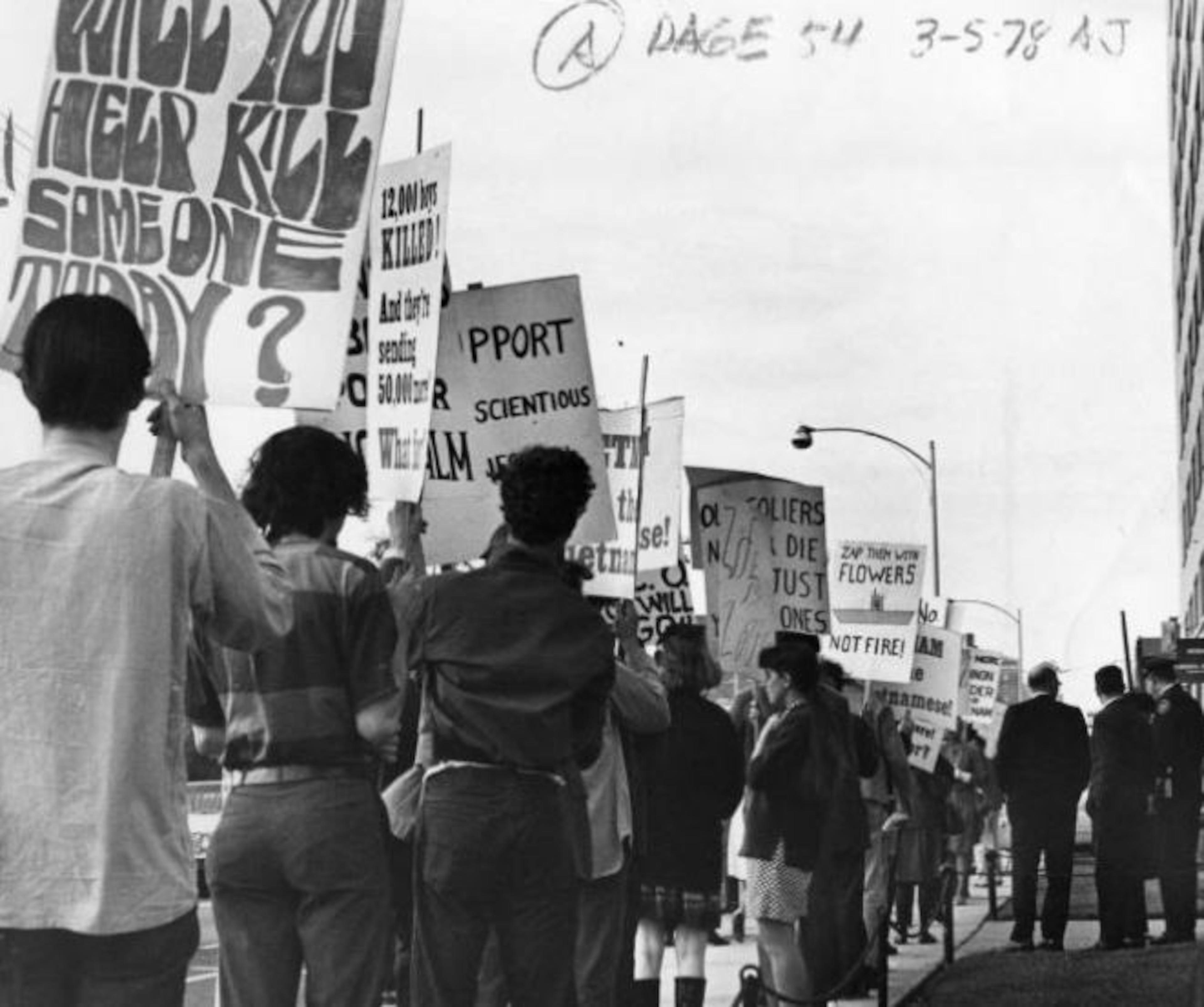 Oct. 17, 1967 -- Vietnam War protesters picket in front of the Peachtree Selective Service Building. AJC PHOTO ARCHIVES
