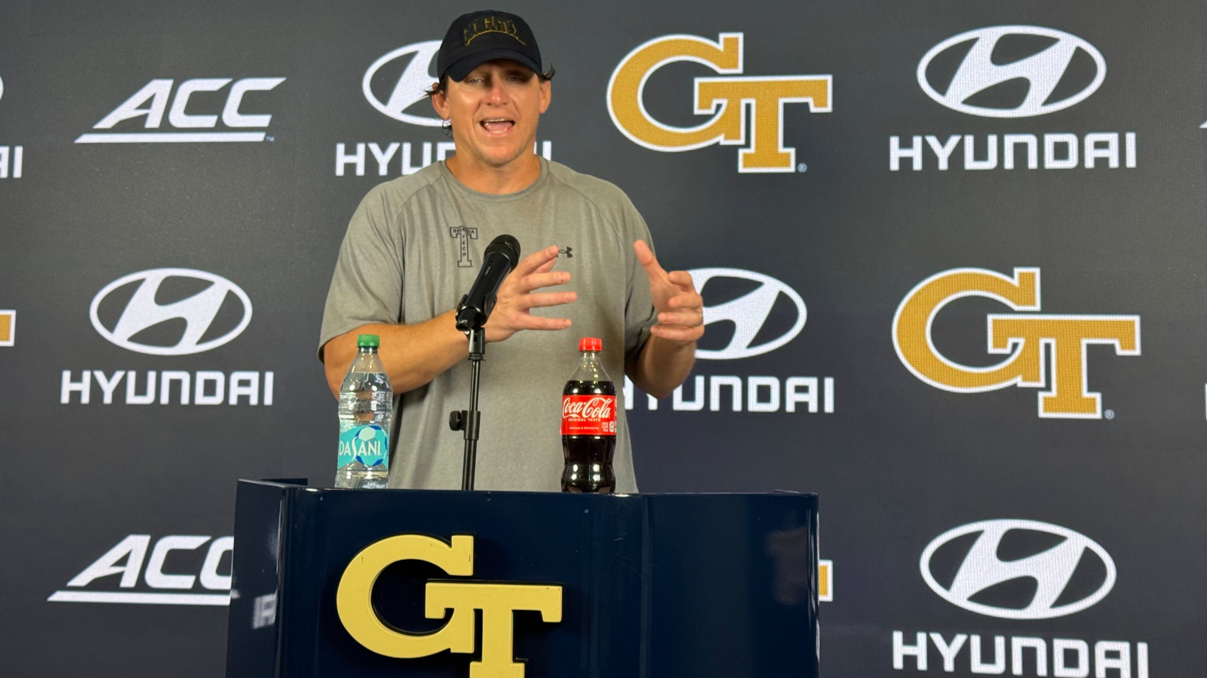 Georgia Tech offensive line coach Allen Mogridge speaks during a news conference after the Yellow Jackets’ seventh day of fall camp on Tuesday, Aug. 11, 2026, in Atlanta. Mogridge has worked to maintain a bond with offensive lineman Josh Petty. (Fisher Isbell/AJC)