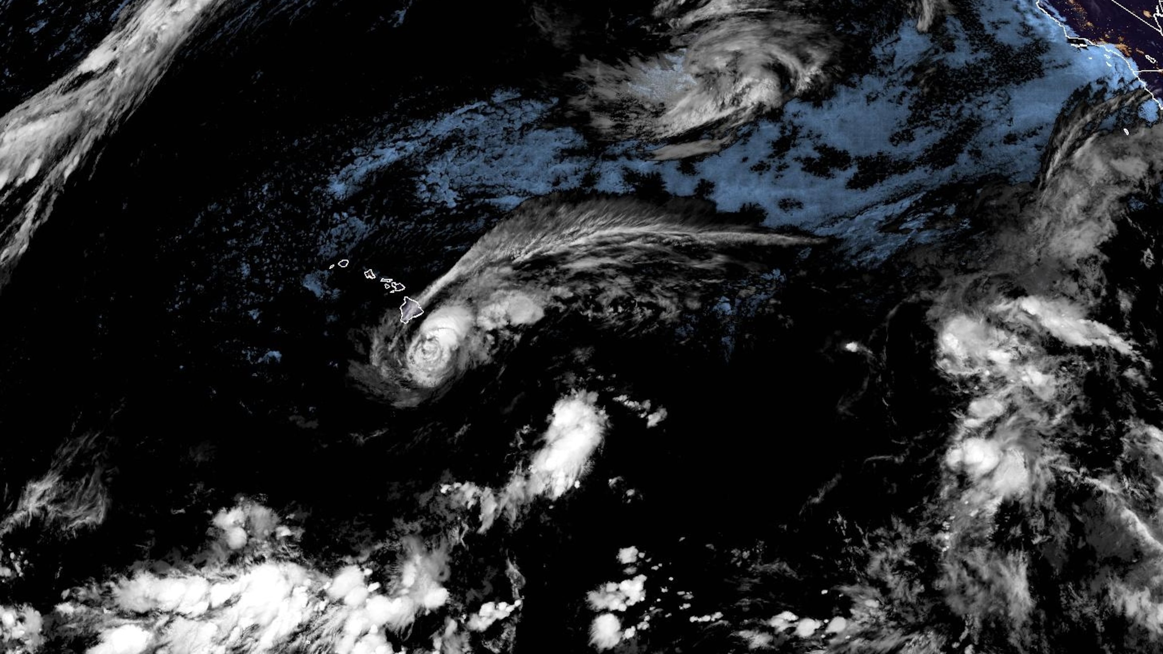 This satellite image released by NOAA shows Tropical Storm Lala over the Pacific Ocean, near Hawaii, Saturday, Aug. 15, 2026. (NOAA via AP)