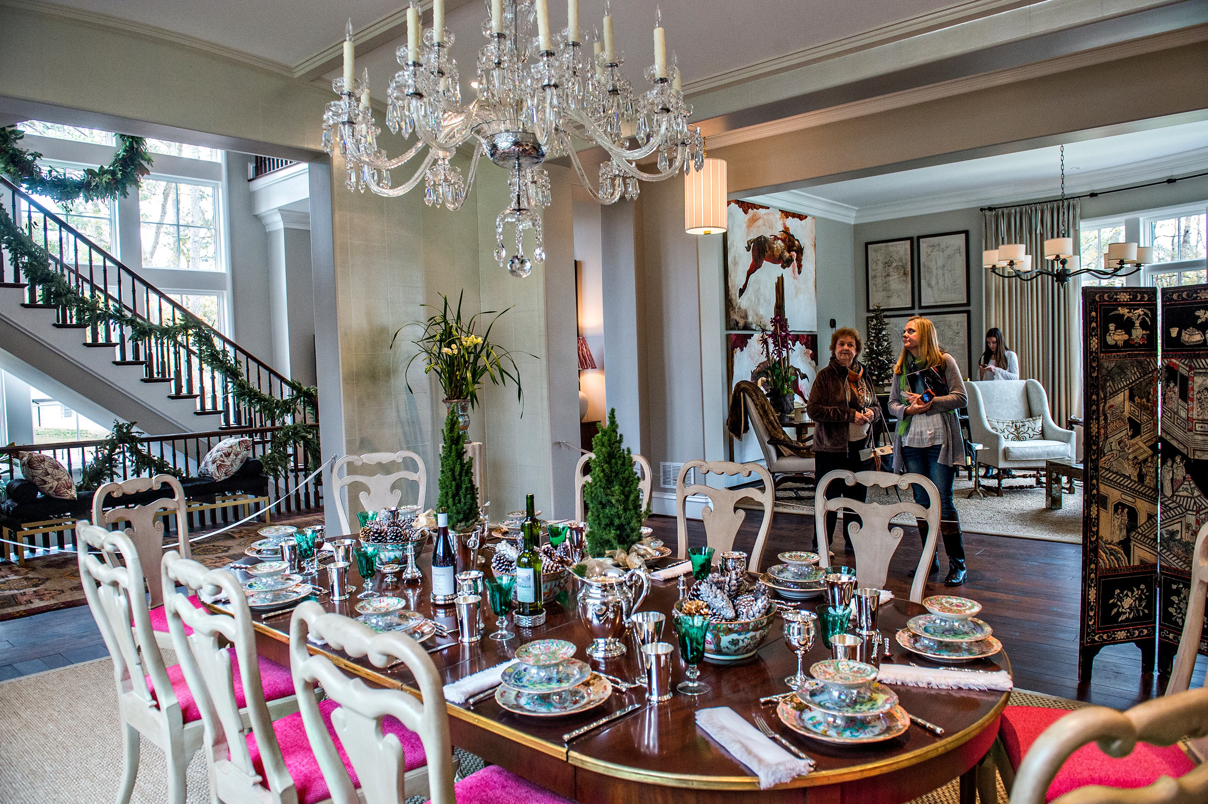 November 21, 2015 Atlanta - Missy Dyches (right) and her mother-in-law Faye look in the dining room inside the 2015 Home for the Holidays Designer Showhouse located at 1150 West Garmon Rd. in Atlanta on Saturday, November 21, 2015. This year's 15,000 sq. ft. estate is a collaboration between renowned architecture firm, Harrison Design, and Sheehan Built Homes. Inspired by Scotland's Stonefield Castle, the sprawling "Millwood Manor" is open through Sunday, Dec. 13. JONATHAN PHILLIPS / SPECIAL