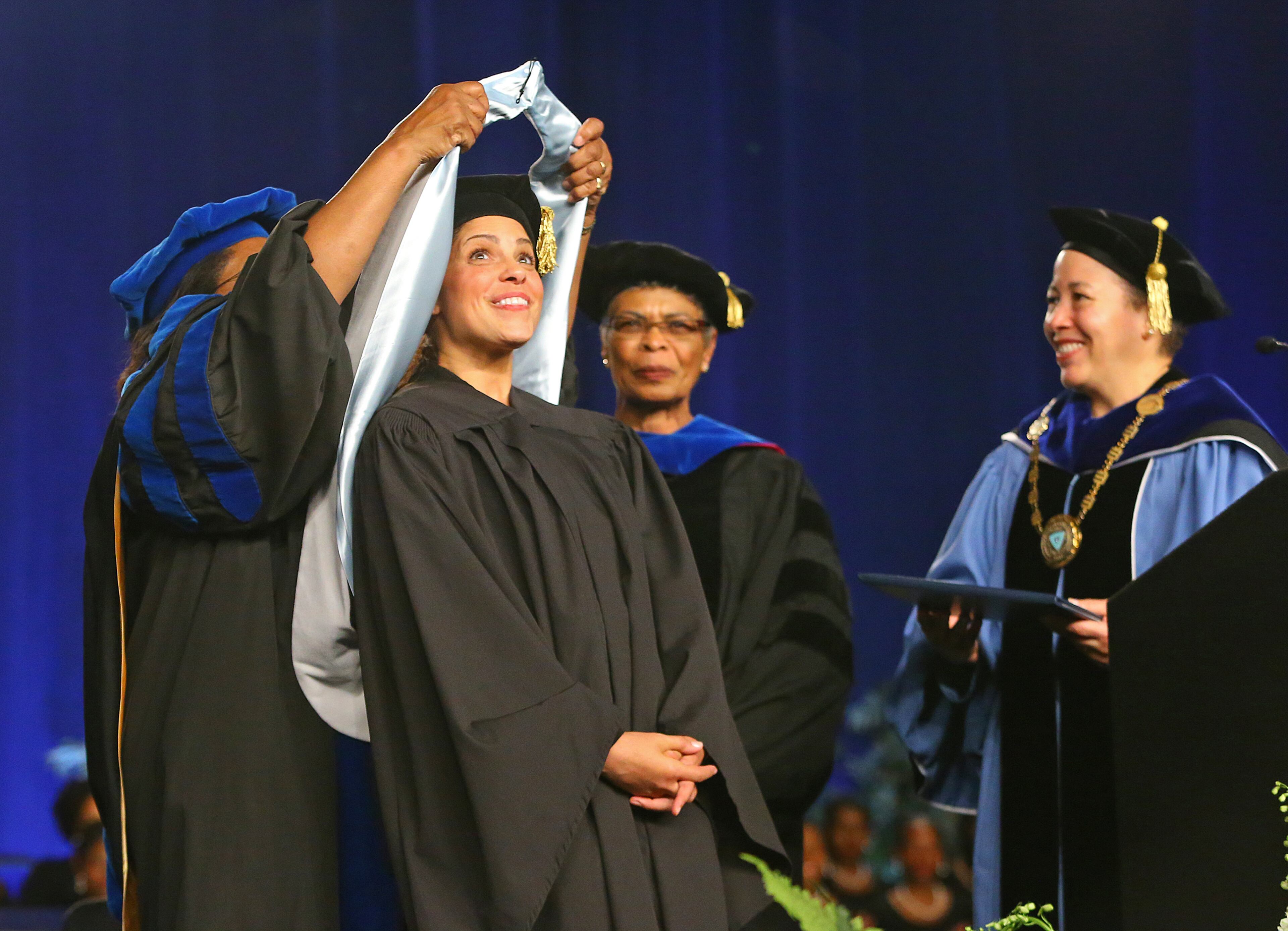 President Beverly Daniel Tatum, PhD, (far right) confers the honarary degree Doctor of Humane Letters to award-winning journalist, entrepreneur and philanthropist Soledad O'Brien (second from left) after she delivered the commencement address during the Spelman College 127th Commencement at the Georgia World Congress Center on Sunday, May 18, 2014, in Atlanta. CURTIS COMPTON / CCOMPTON@AJC.COM