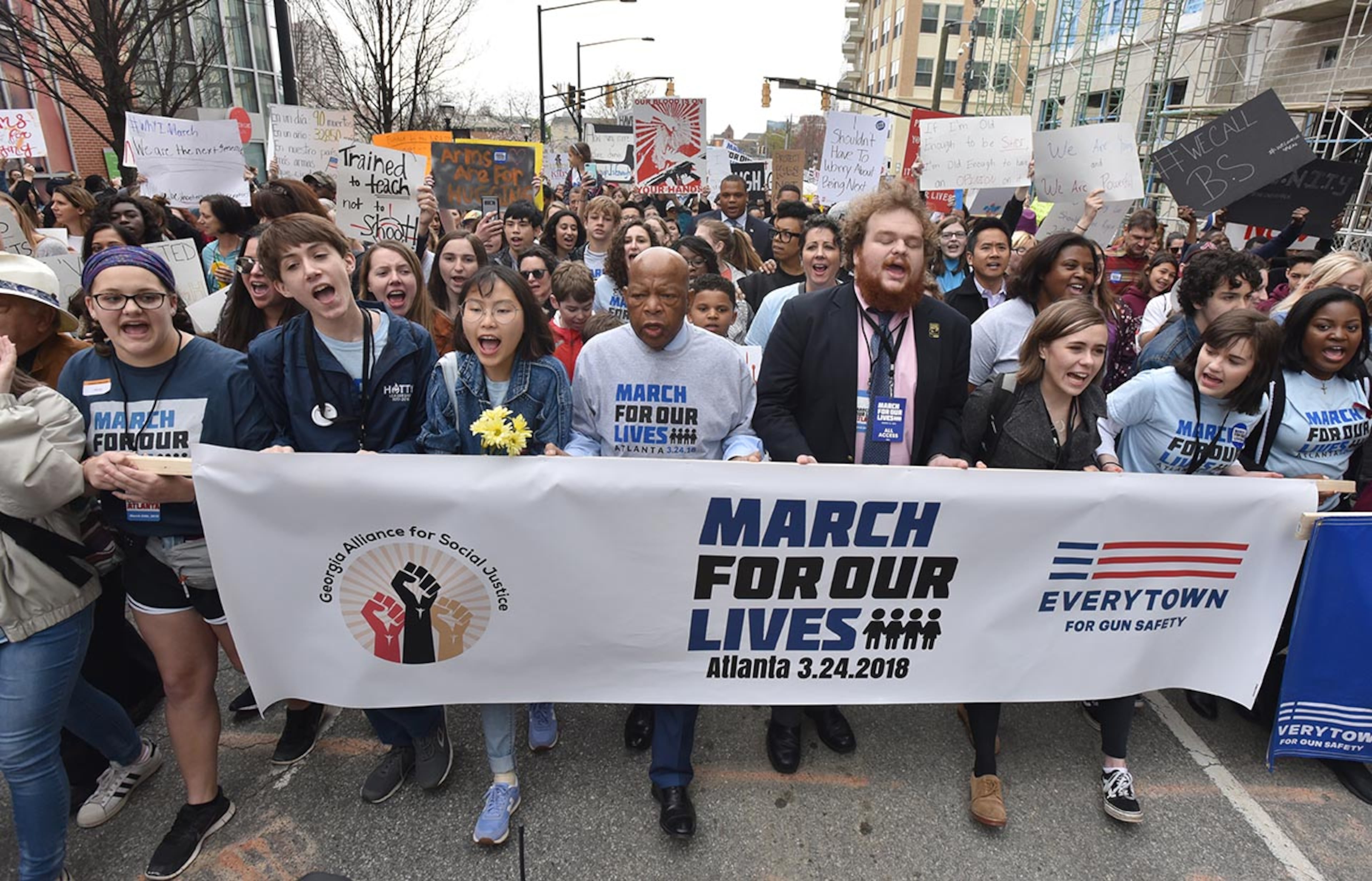 March 24, 2018 Atlanta - U.S. Rep. John Lewis and other young leaders lead protesters to Liberty Plaza during the March For Our Lives rally on Saturday, March 24, 2018. Atlanta police estimated the crowd at near 30,000 for todayâÃôs March for Our Lives. People of all ages were drawn to one of the nationwide demonstrations in a movement begun by student survivors of last monthâÃôs mass killing in a Parkland, Fla., school. Some of those Florida students were among the speakers in Atlanta. HYOSUB SHIN / HSHIN@AJC.COM