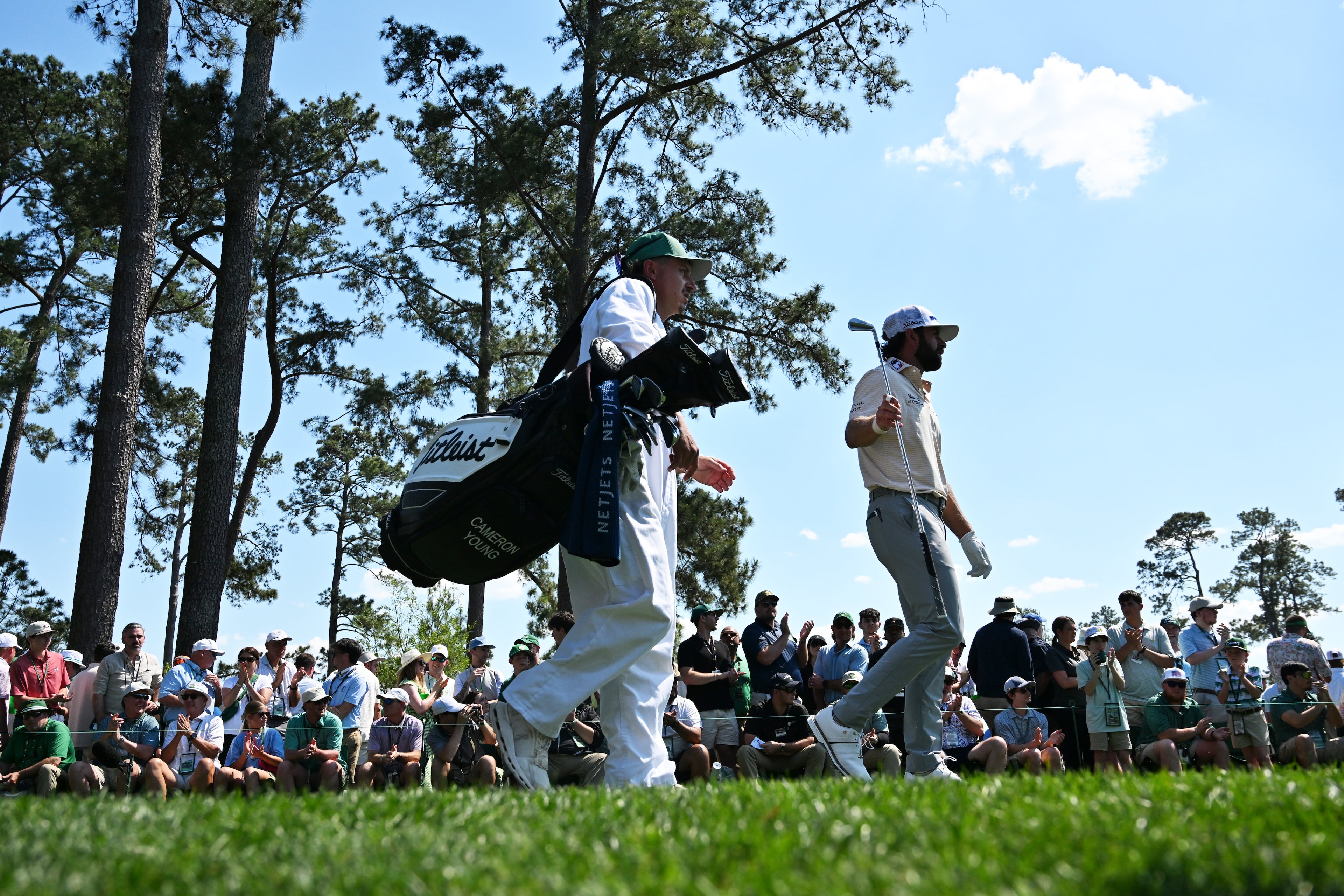 Cameron Young and caddie Kyle Sterbinsky walk down fourth fairway during final round of the Masters, at Augusta National Golf Club, Sunday, April 12, 2026, in Augusta, GA (Hyosub Shin/AJC)