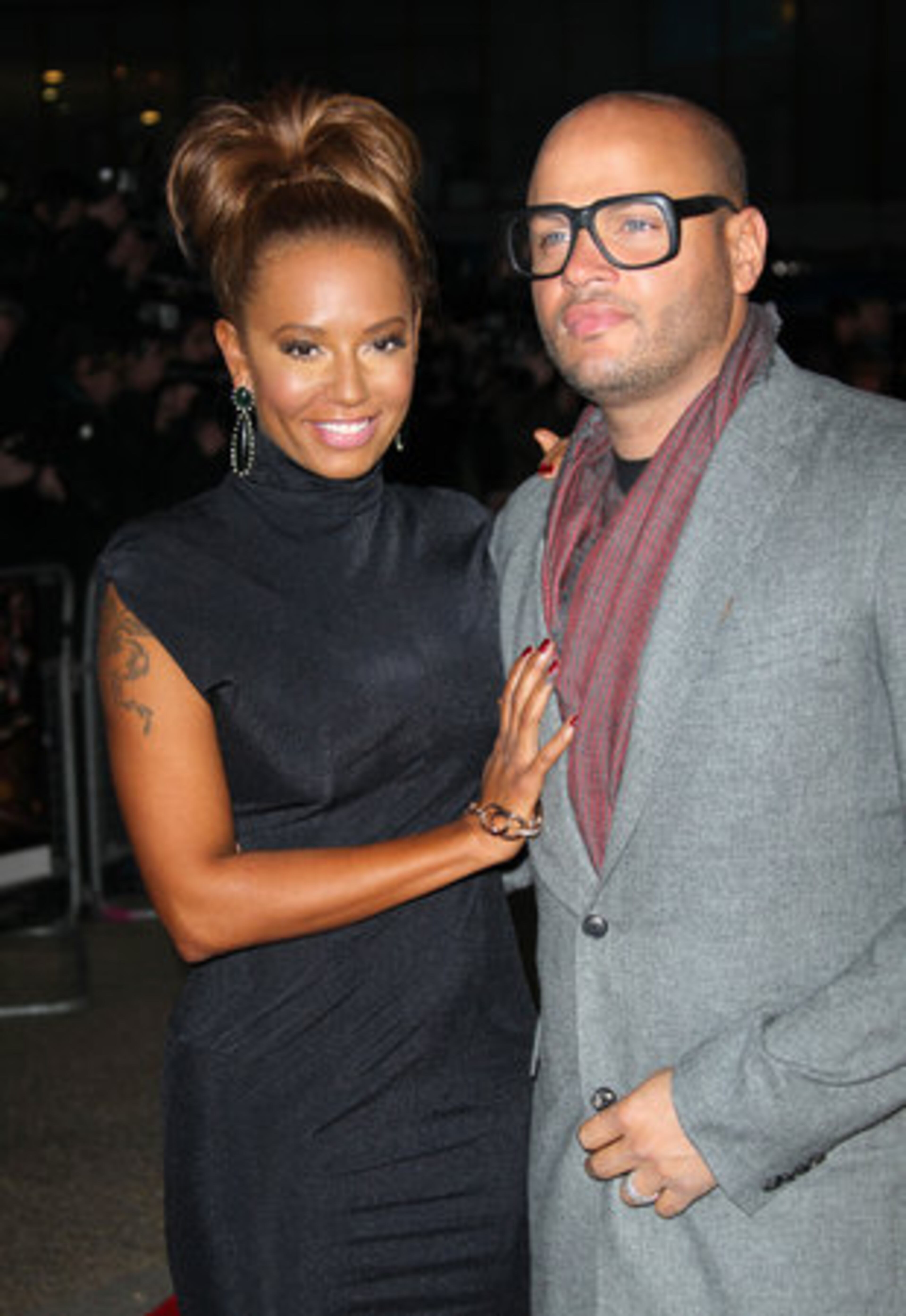 Former Spice Girls star Melanie Brown and husband Stephen Belafonte arrive at "The Hunger Games" UK premiere at the O2 arena in London.
