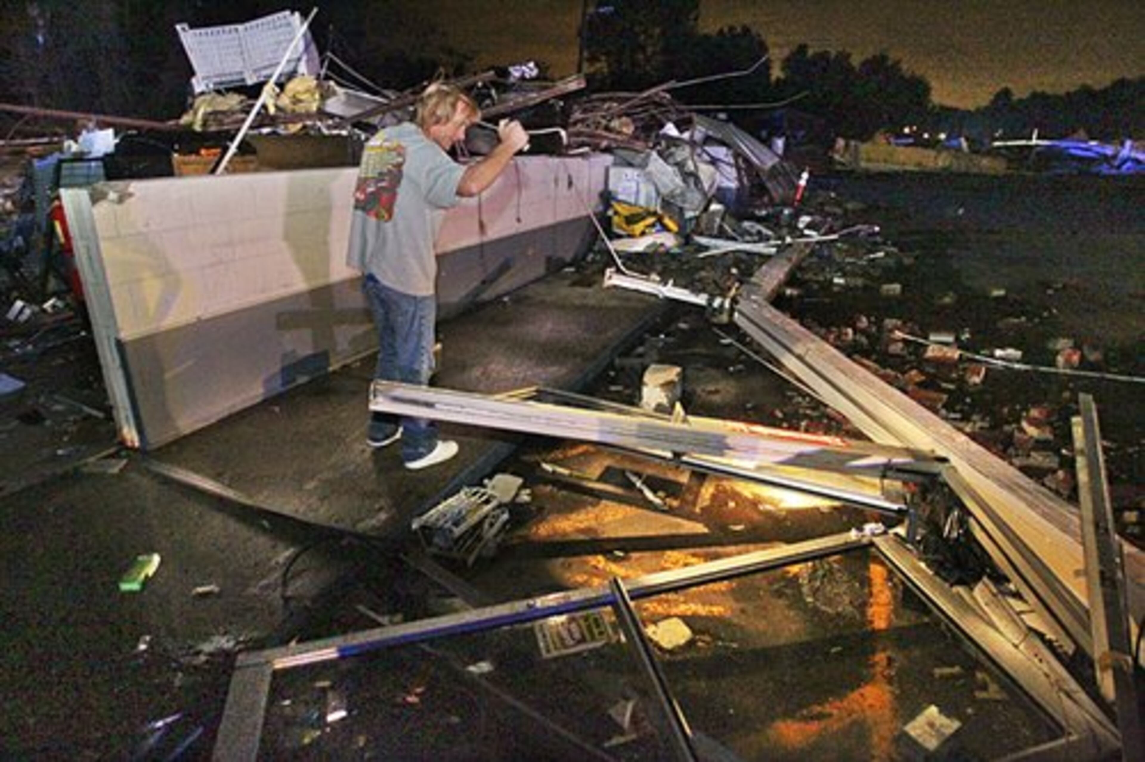 Owner of the Shell gas station Roy Brown looks for important items from his convenience store.