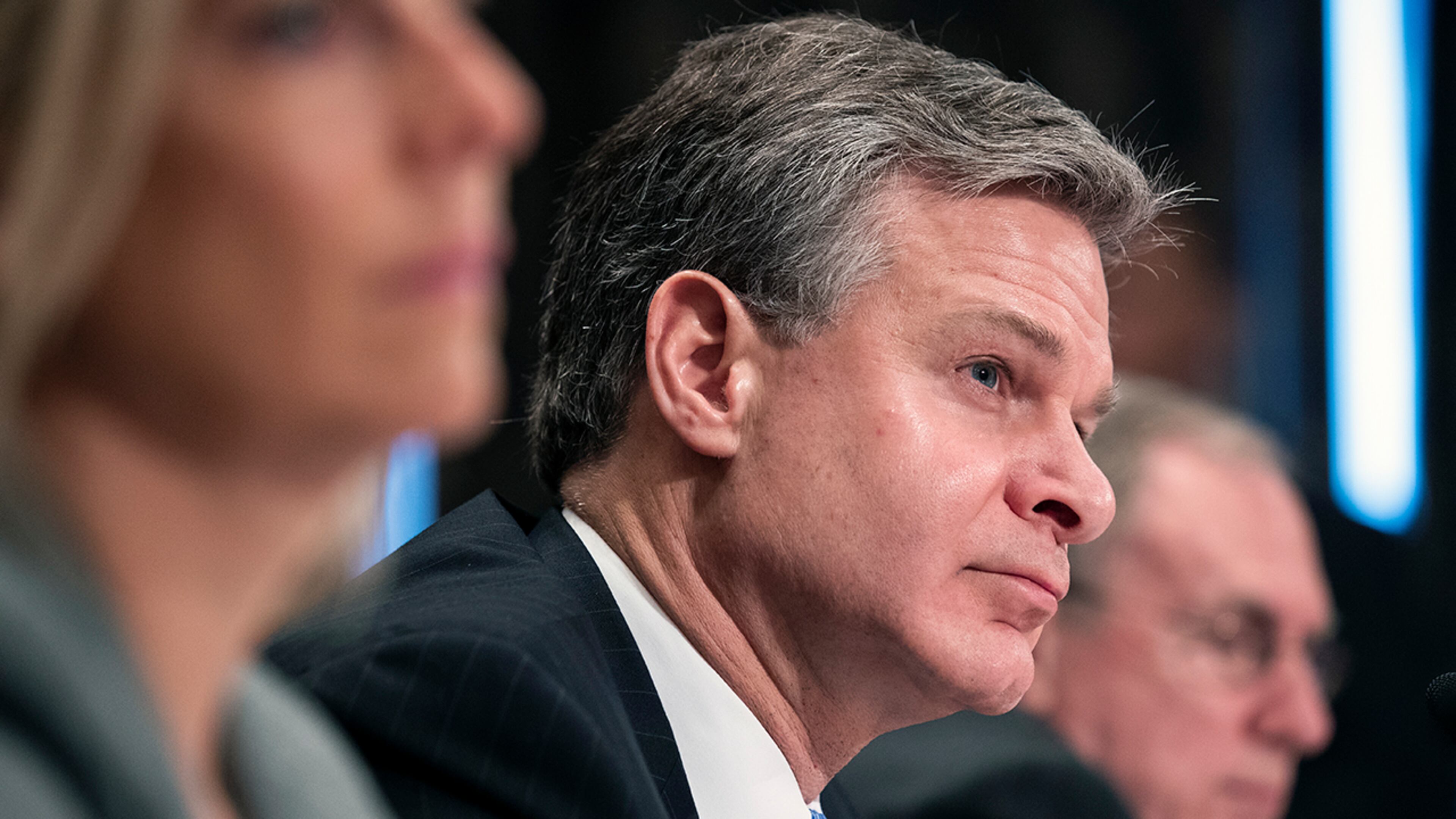 Homeland Security Secretary Kirstjen Nielsen, left, FBI Director Christopher A. Wray, and National Counterterrorism Center acting director Russell Travers, testify during a hearing of the Senate Committee on Homeland Security & Governmental Affairs, on Capitol Hill, Wednesday, Oct. 10, 2018 in Washington. (AP Photo/Alex Brandon)