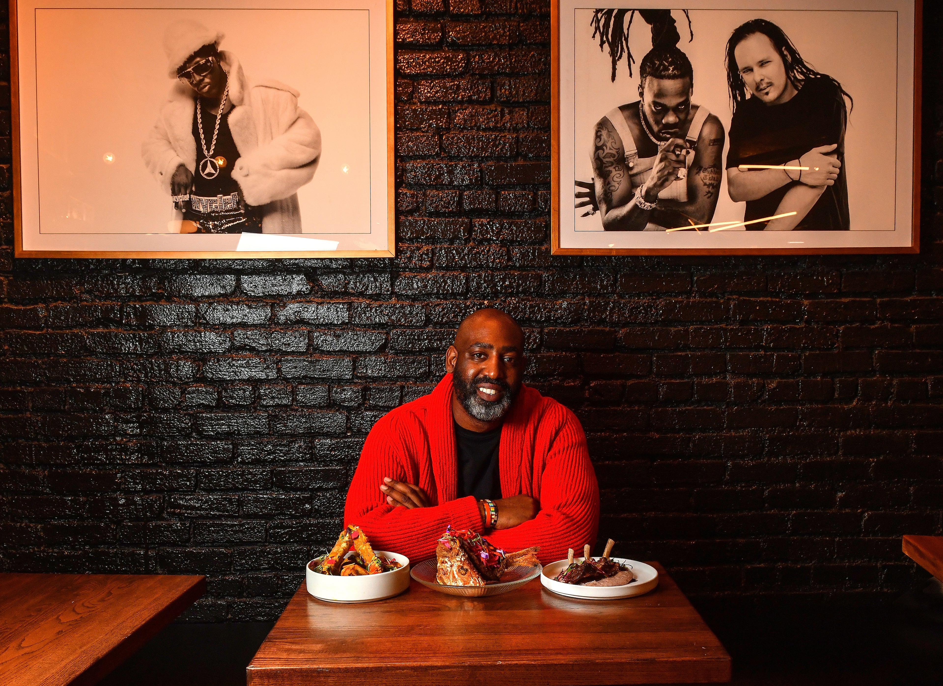 Sim Walker, owner of Apt 4B, in the restaurant's dining room in 2021 (Chris Hunt for the AJC)