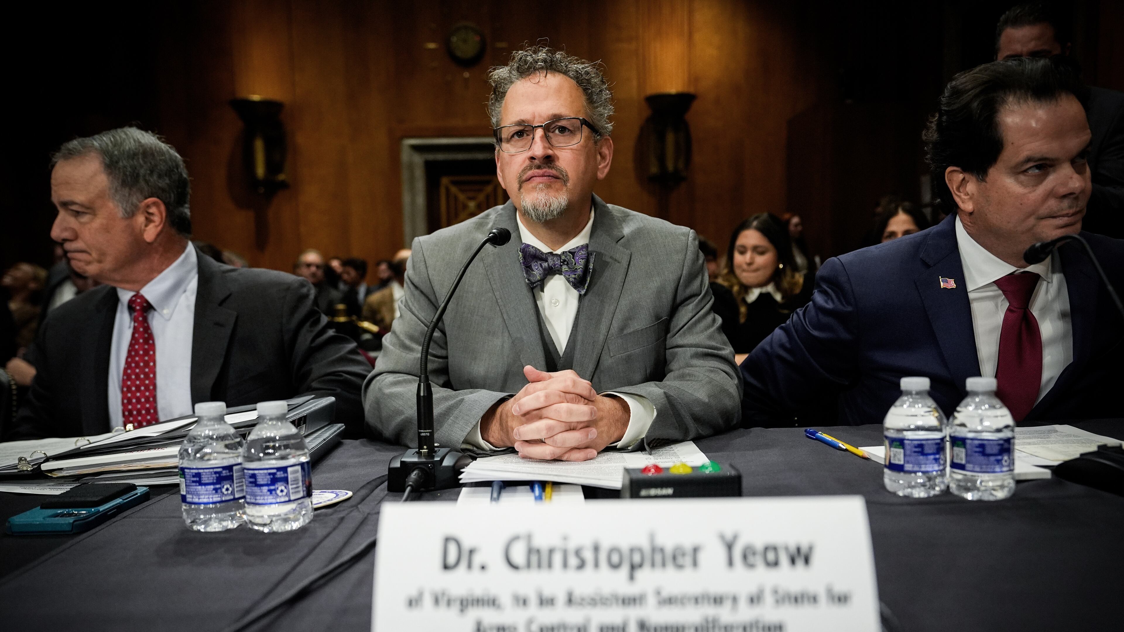 FILE - Christopher Yeaw, center, arrives to a Senate Foreign Relations Committee confirmation hearing on his nomination to be an assistant Secretary of State, Nov. 19, 2025, on Capitol Hill in Washington. (AP Photo/Julia Demaree Nikhinson, File)