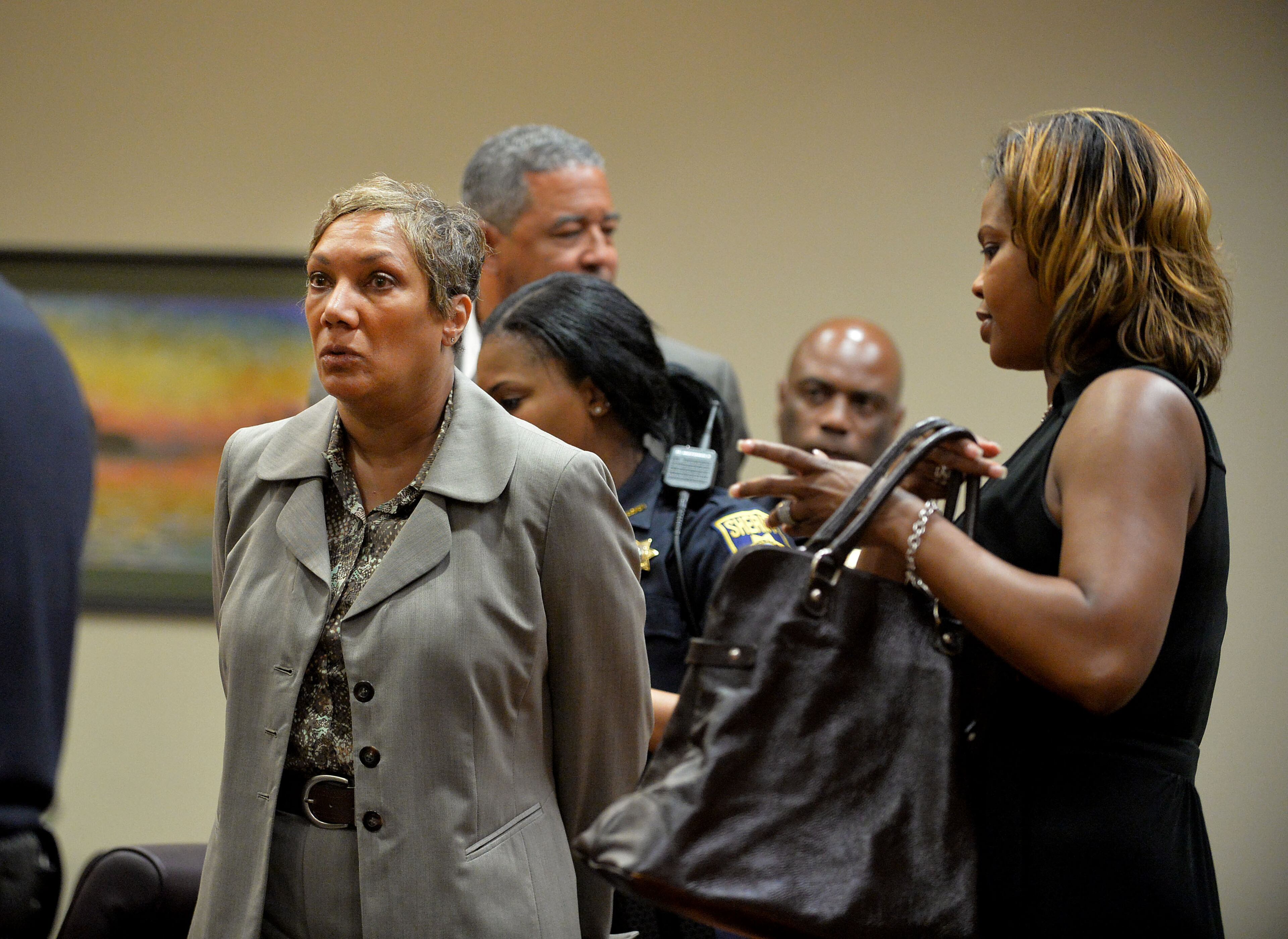 Pat Reid and Tony Pope are returned to custody after DeKalb Superior Court Judge Gregory A. Adams signed an arrest warrant following a motions hearing, Tuesday, May 12, 2015. They're asking for a new trial and petitioning to be released from prison awaiting the trial. KENT D. JOHNSON /KDJOHNSON@AJC.COM