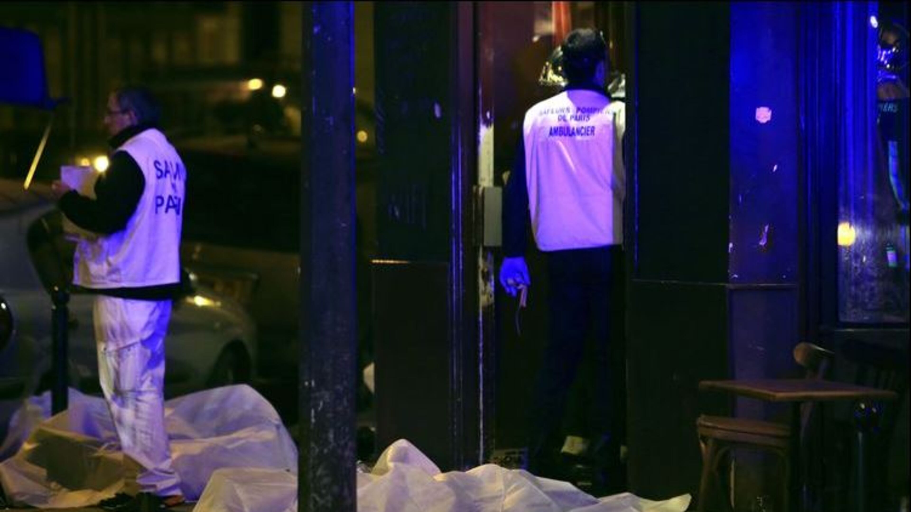 Victims lay on the pavement in a Paris restaurant, Friday. (AP Photo / Thibault Camus)