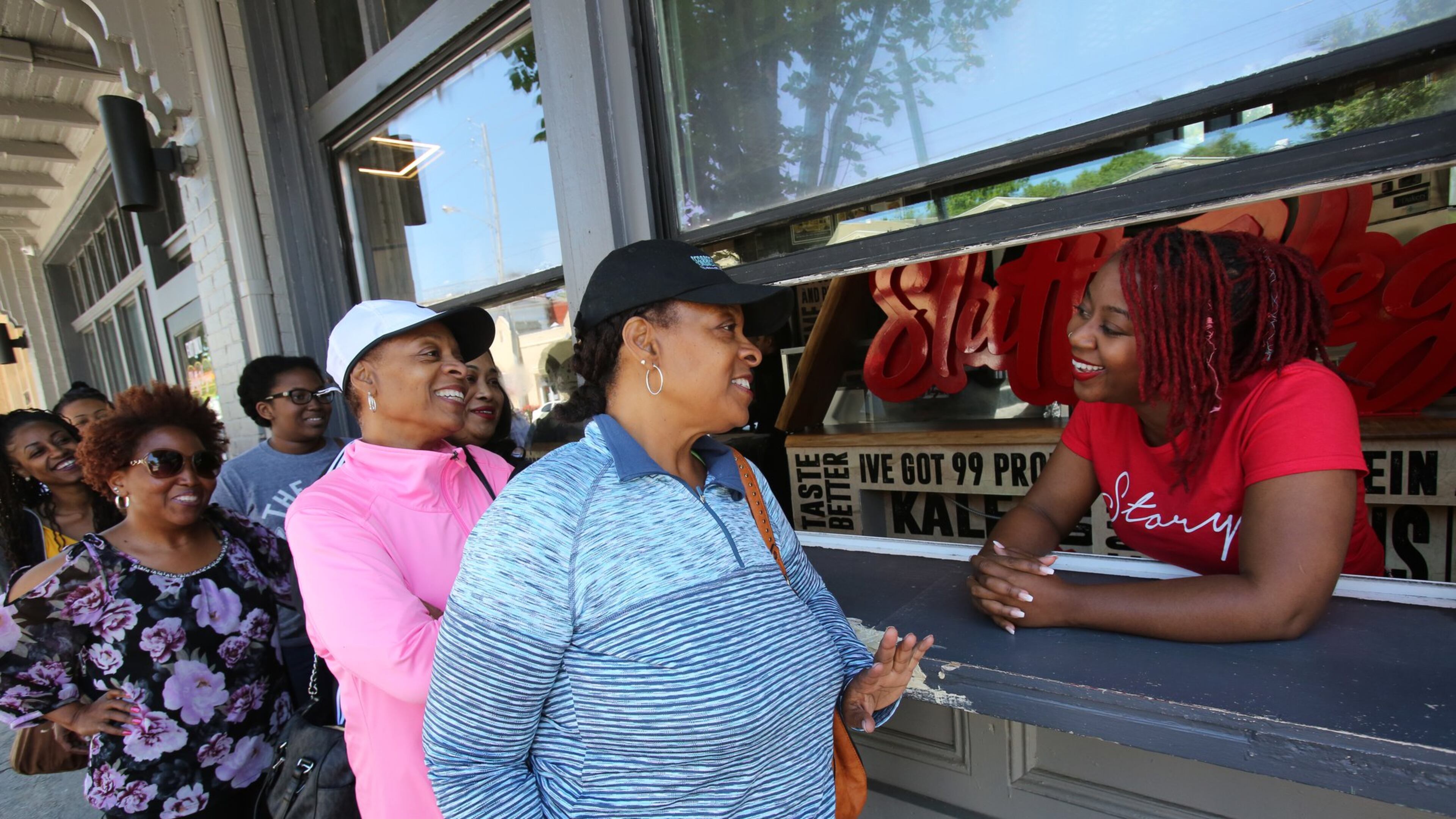 Customers wait in line at Slutty Vegan, owned by Pinky Cole. The vegan restaurant sells 1,600 burgers daily. TYSON A. HORNE / TYSON.HORNE@AJC.COM