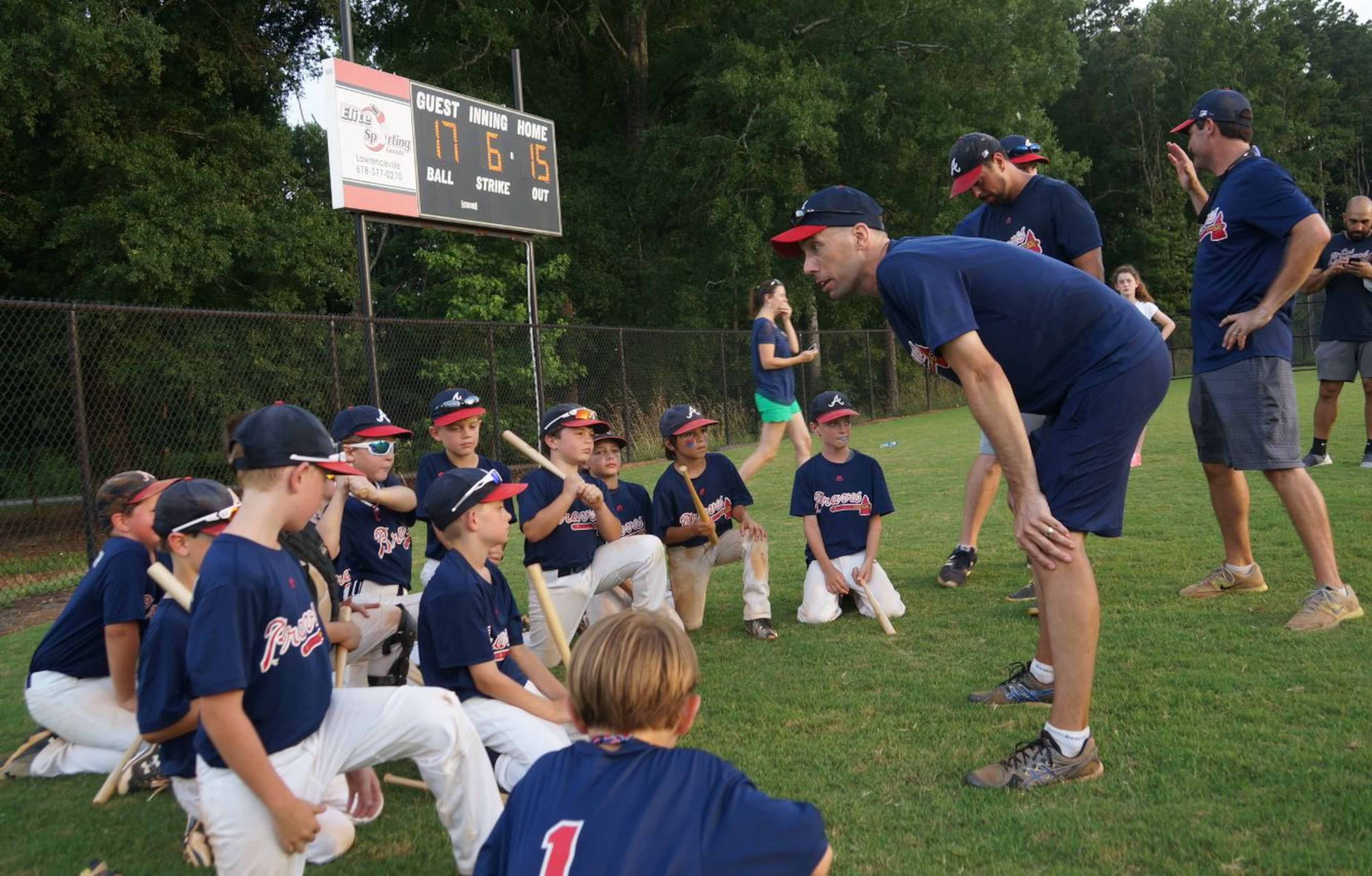 Patrick Rosa coaches his team from Brookhaven at a baseball tournament.