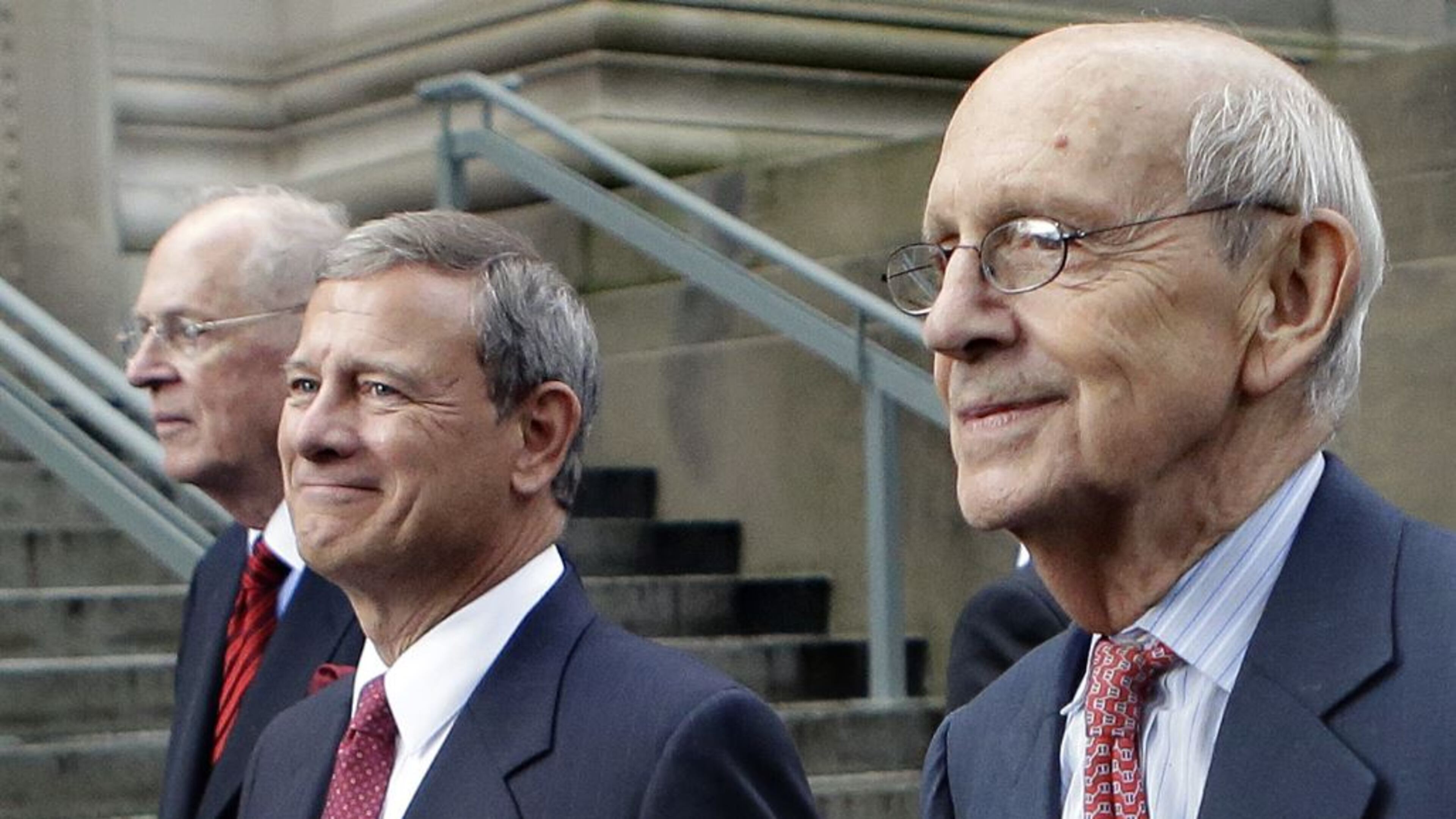 Supreme Court Justices Anthony Kennedy, left, and Stephen Breyer, right, walk with Chief Justice John Robert during a procession last week at Harvard Law School. (Steven Senne / Associated Press)