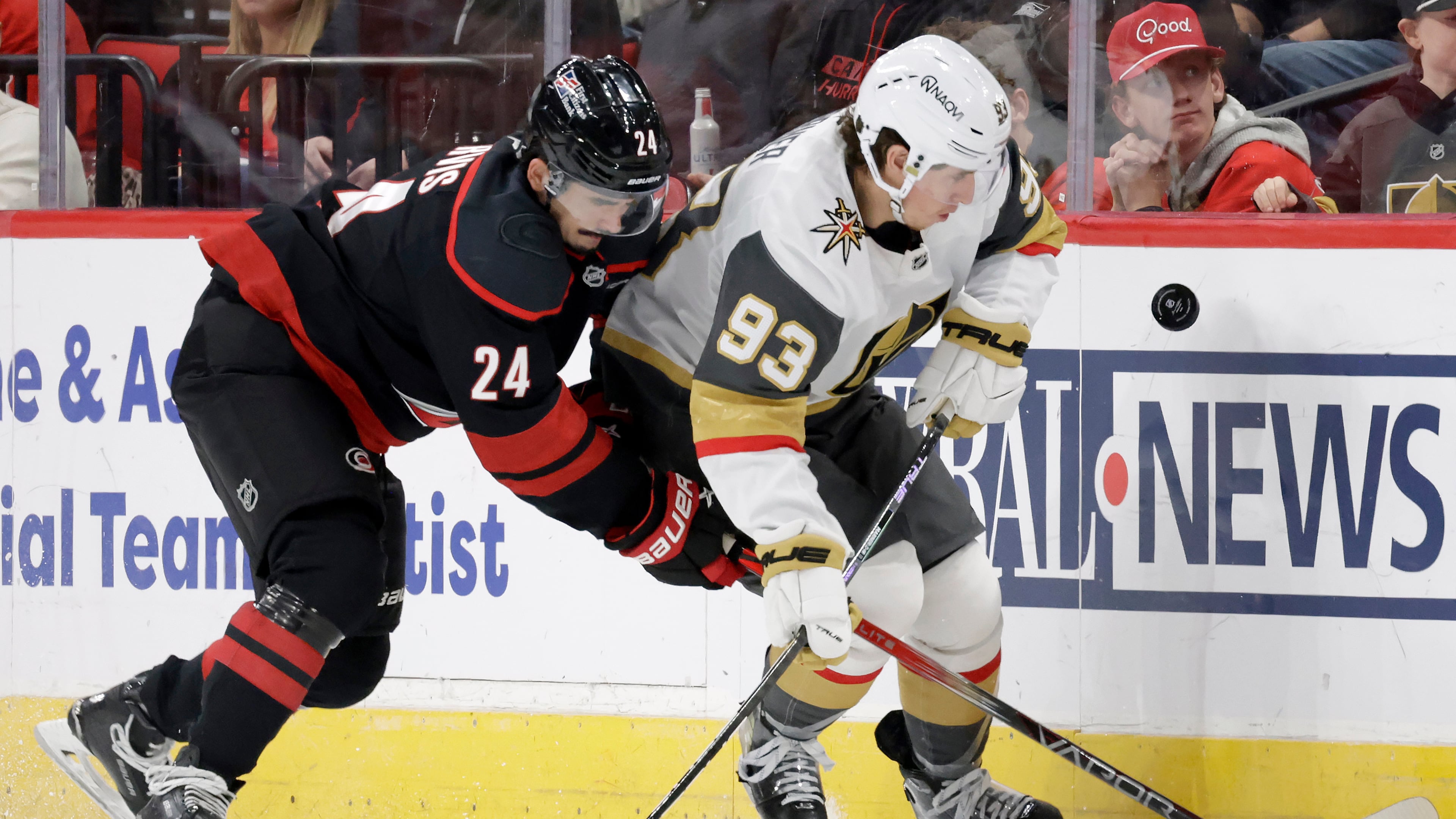 FILE - Carolina Hurricanes center Seth Jarvis (24) and Vegas Golden Knights right wing Mitch Marner (93) go for the puck during the first period of an NHL hockey game, Oct. 28, 2025, in Raleigh, N.C. (AP Photo/Chris Seward, file)