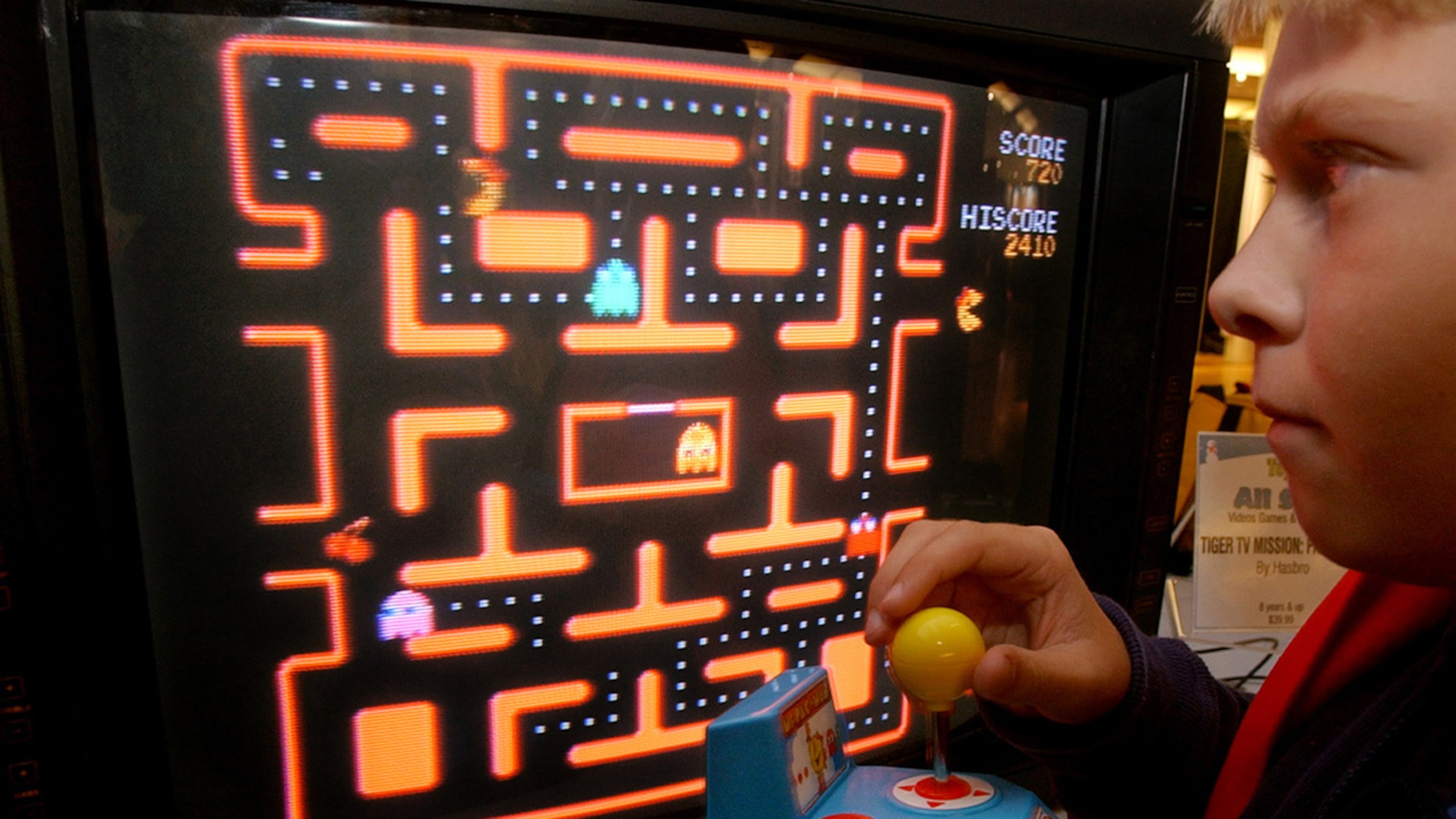 In this Oct. 5, 2004, file photo, Jake Gautney, 12, of Chappaqua, N.Y., tries a Ms. Pac-Man game at the Toy Industry Association holiday preview in New York. Masaya Nakamura, the "Father of Pac-Man" who founded the Japanese video game company behind the hit creature-gobbling game, died on Jan. 22, 2017. He was 91.