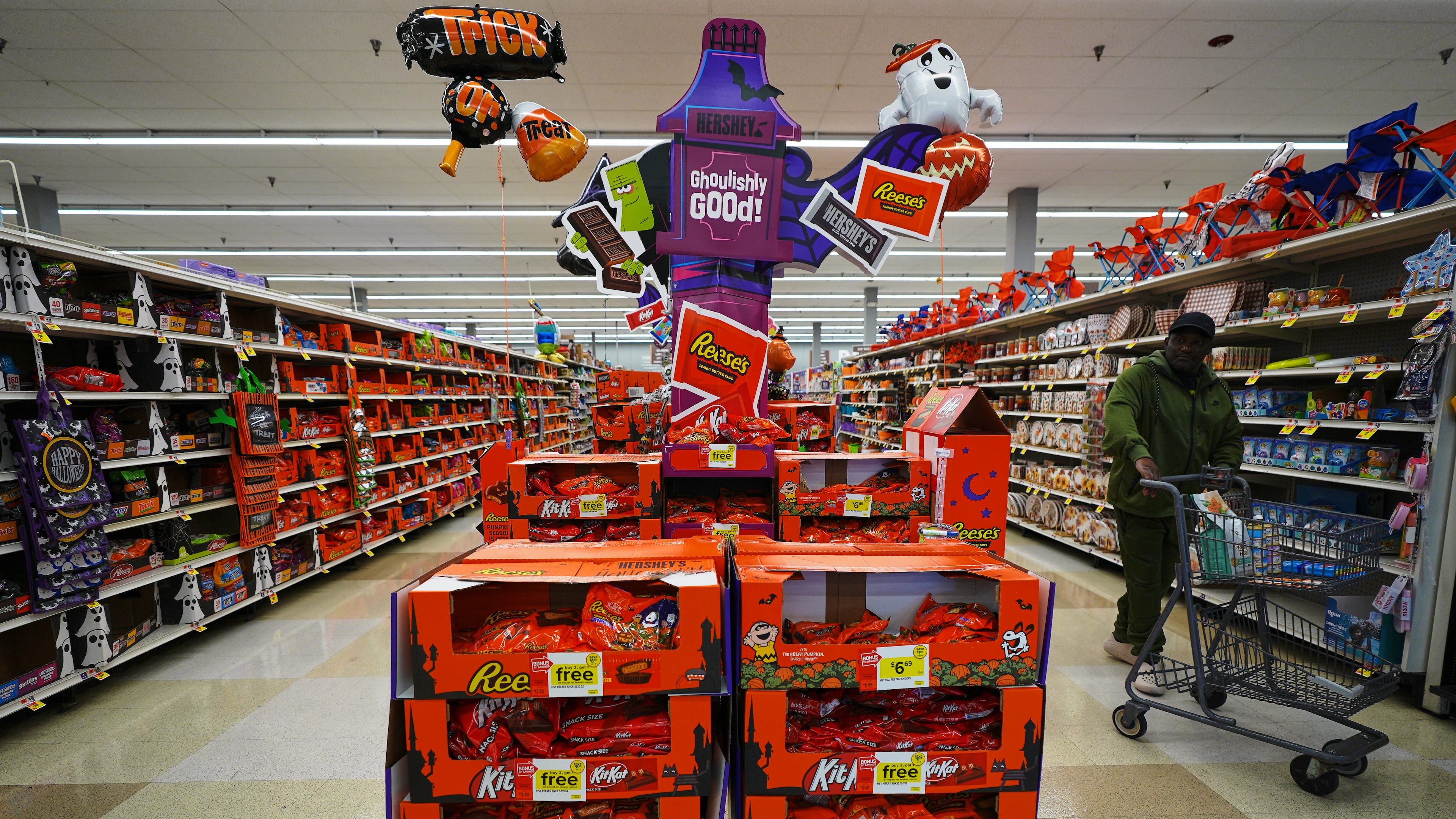 A shopper walks by a Halloween candy display at a Giant grocery store, Thursday, Oct. 22, 2026, in Dundalk, Md. (AP Photo/Stephanie Scarbrough)